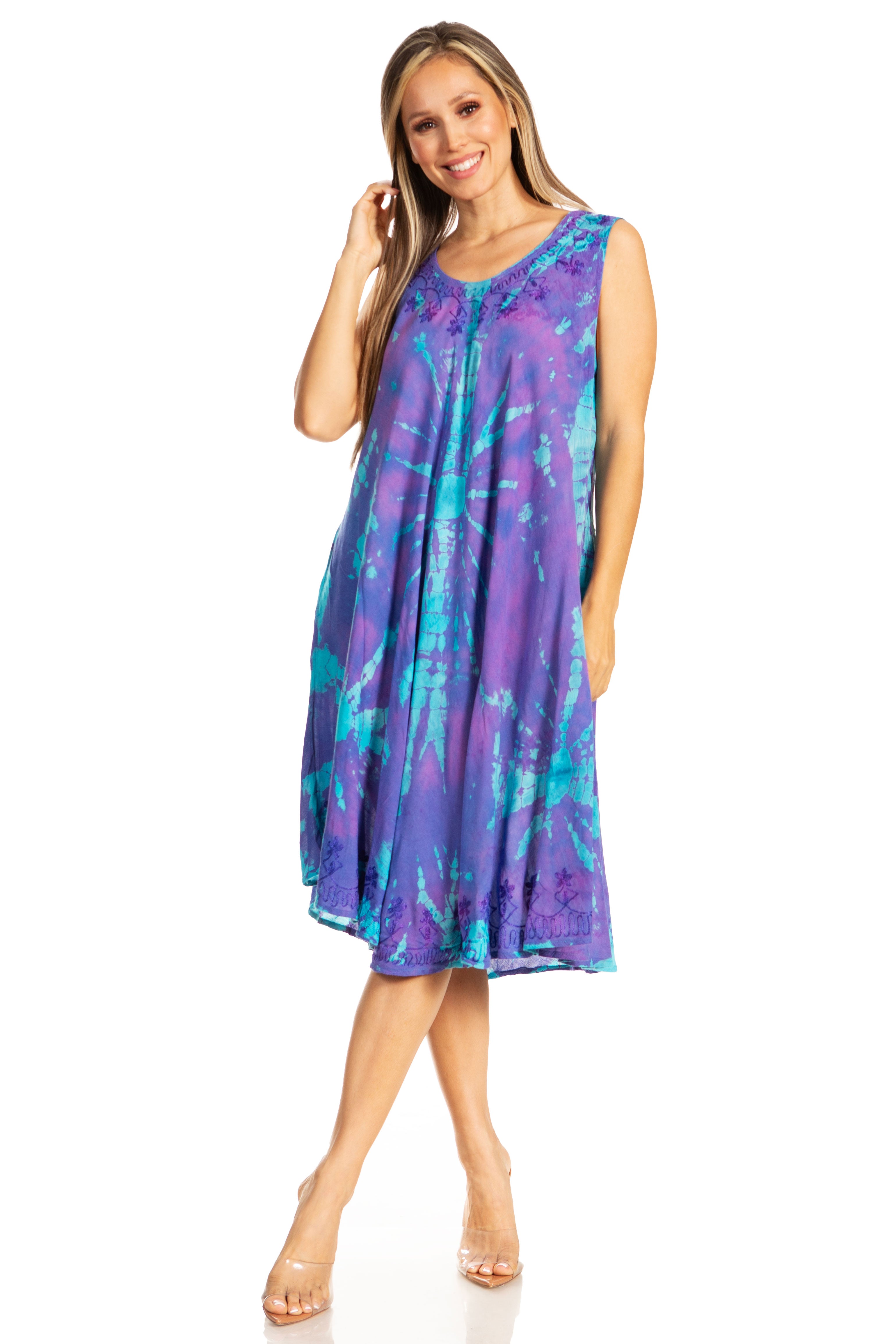 Woman wearing a purple tie-dye dress on a white background