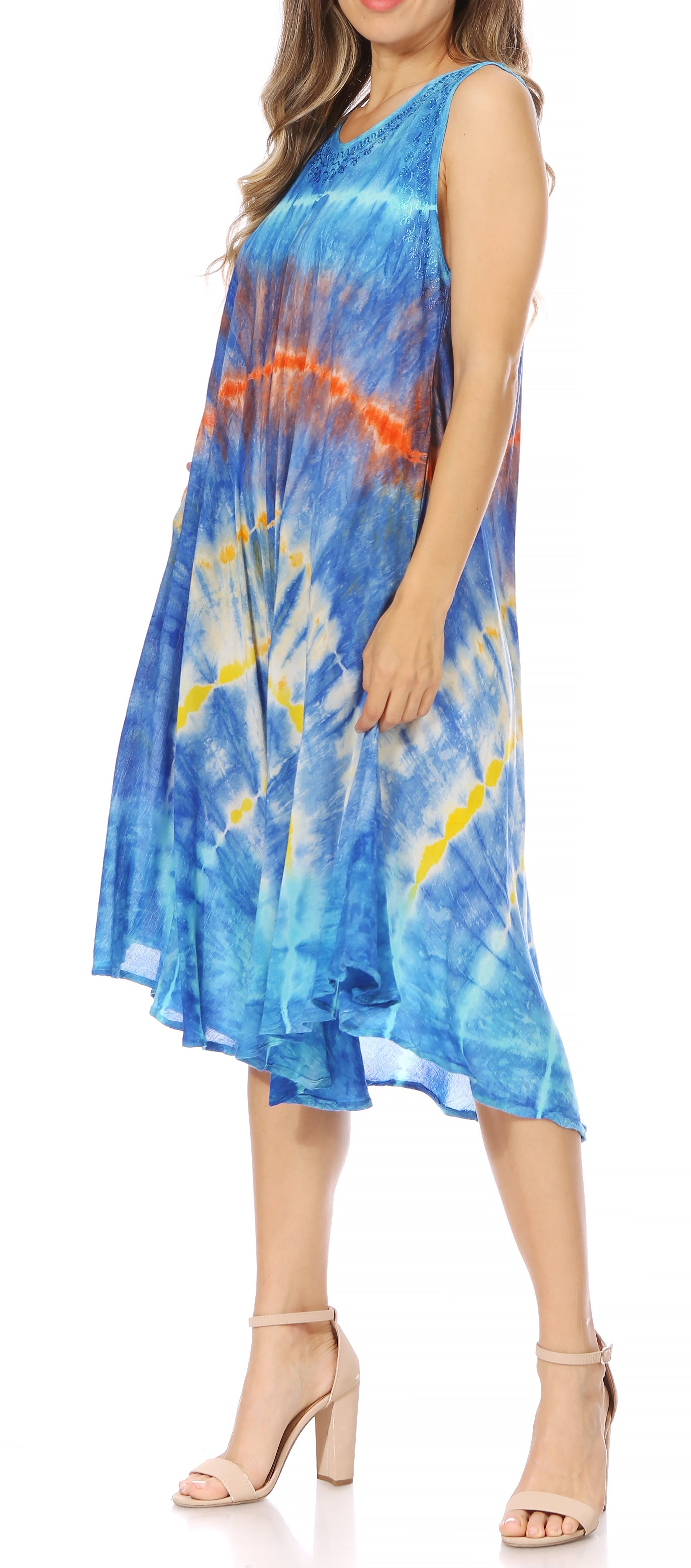 Woman wearing a blue tie-dye dress on a white background