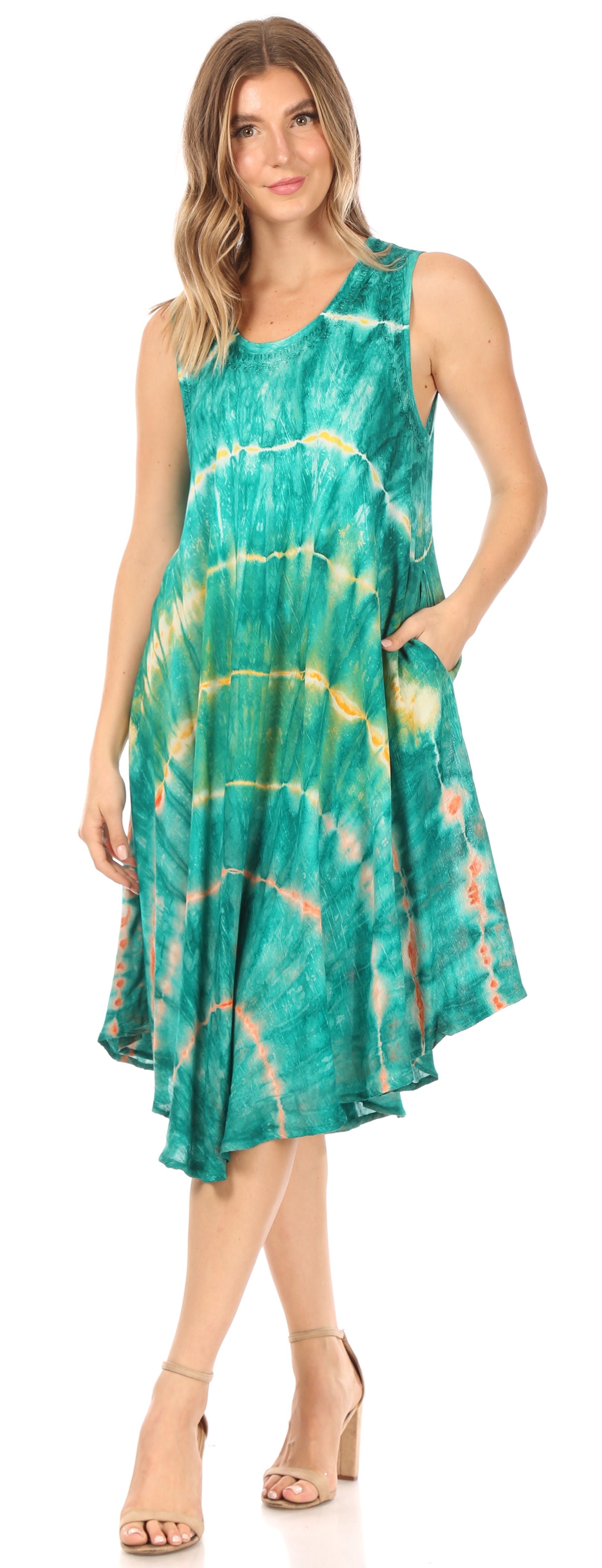 Woman wearing a green tie-dye dress on a white background