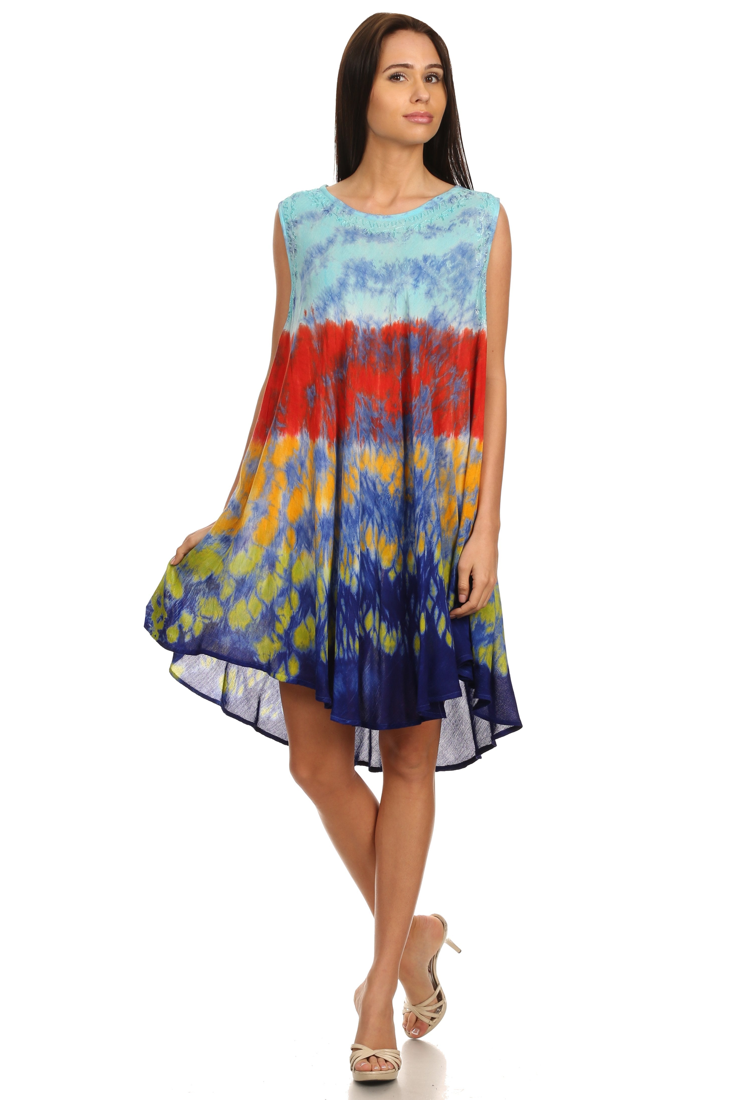Woman wearing a colorful tie-dye dress on a white background
