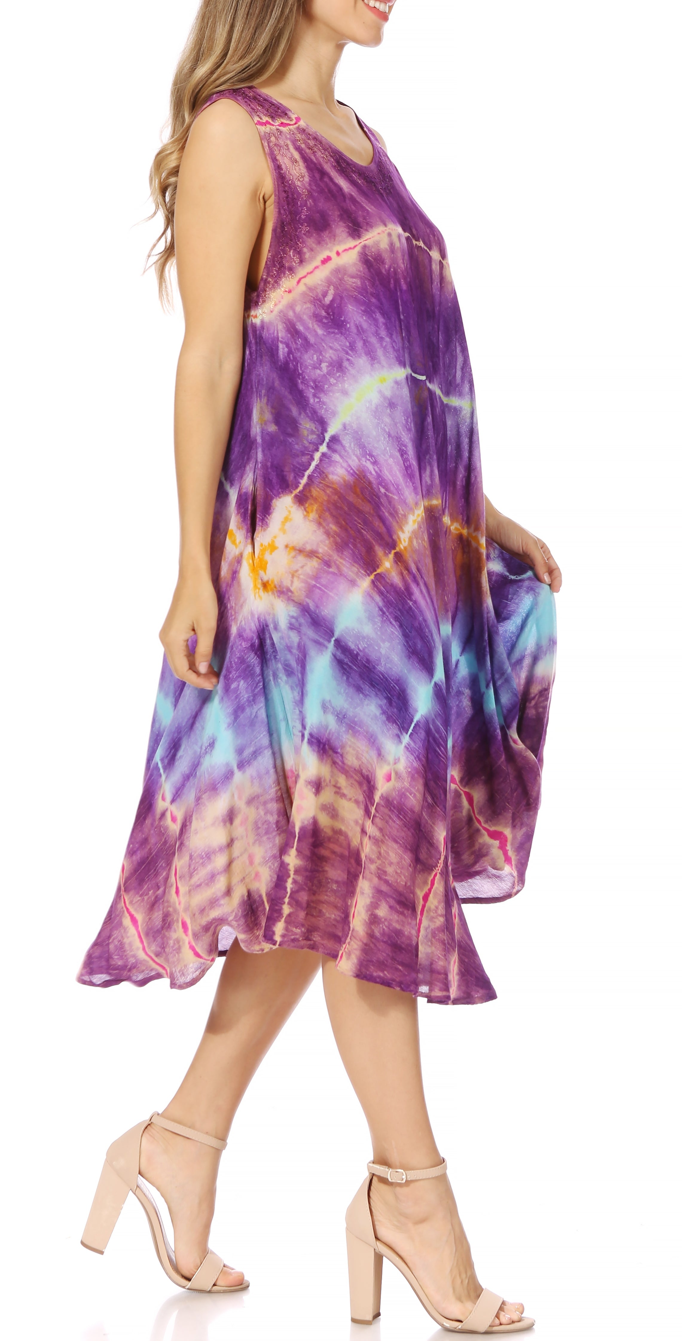 Woman wearing a tie-dye dress on a white background