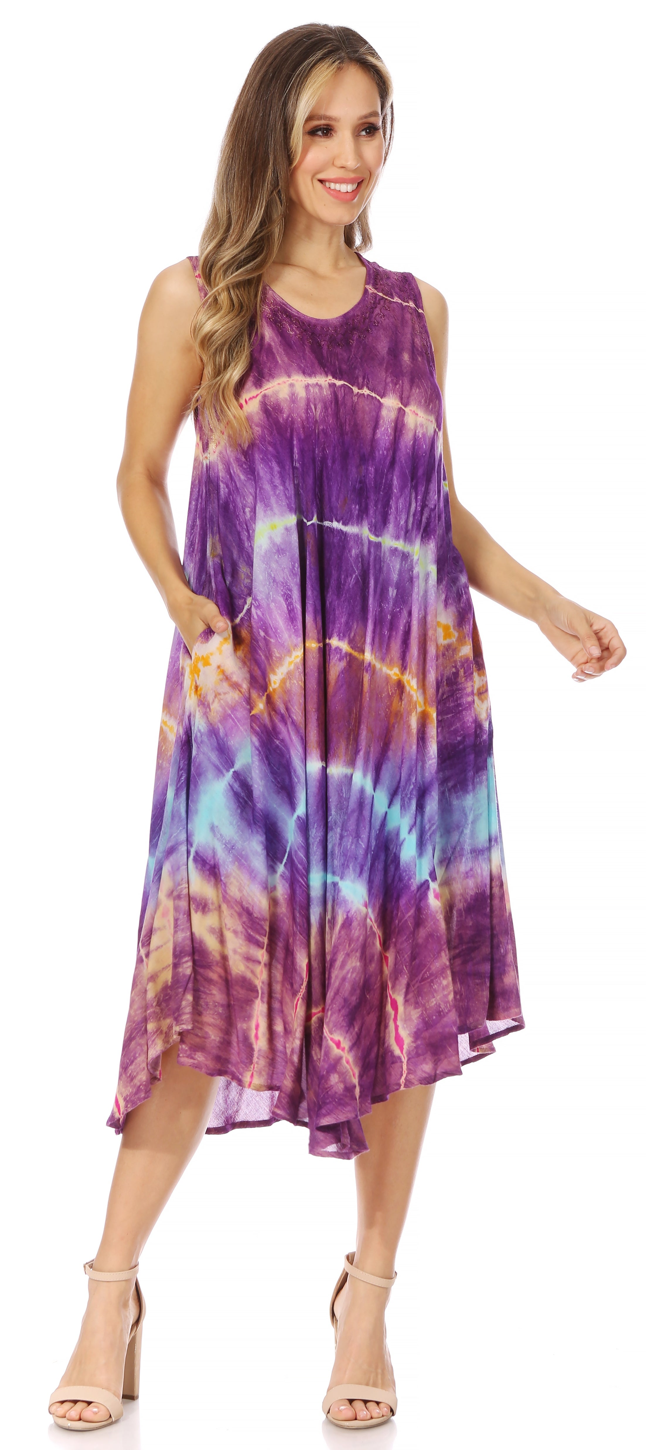 Woman wearing a tie-dye dress with a colorful pattern on a white background