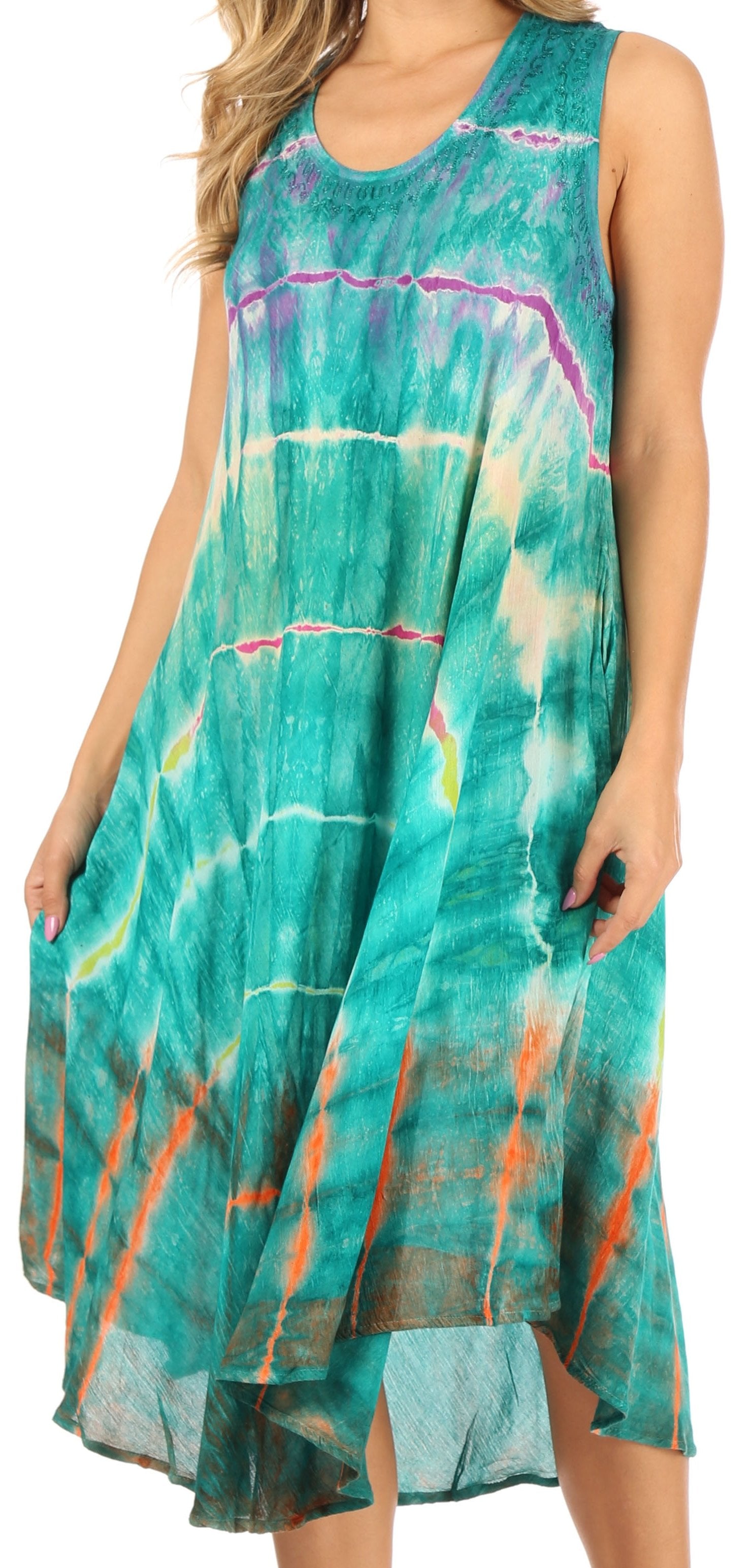 Woman wearing a tie-dye dress with a colorful pattern on a white background
