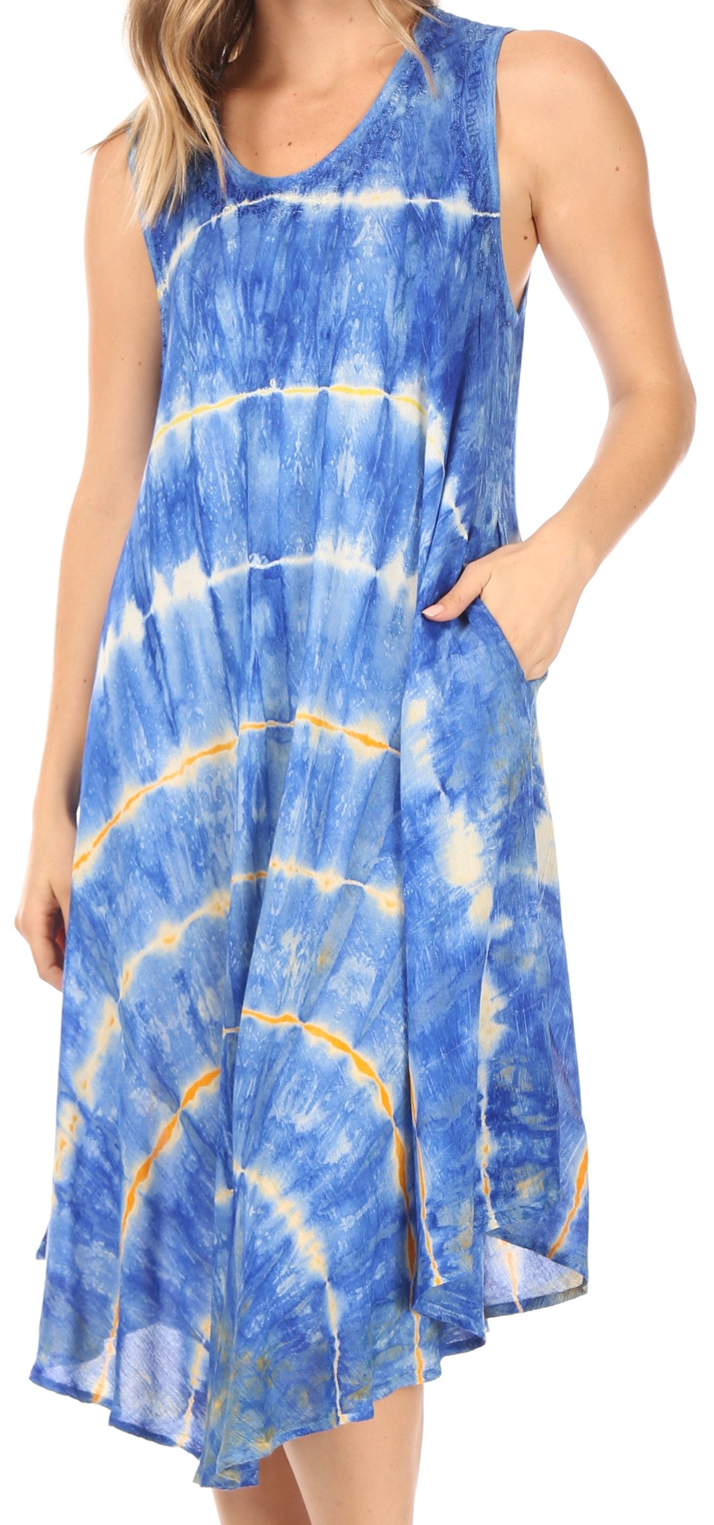Woman wearing a blue tie-dye dress on a white background