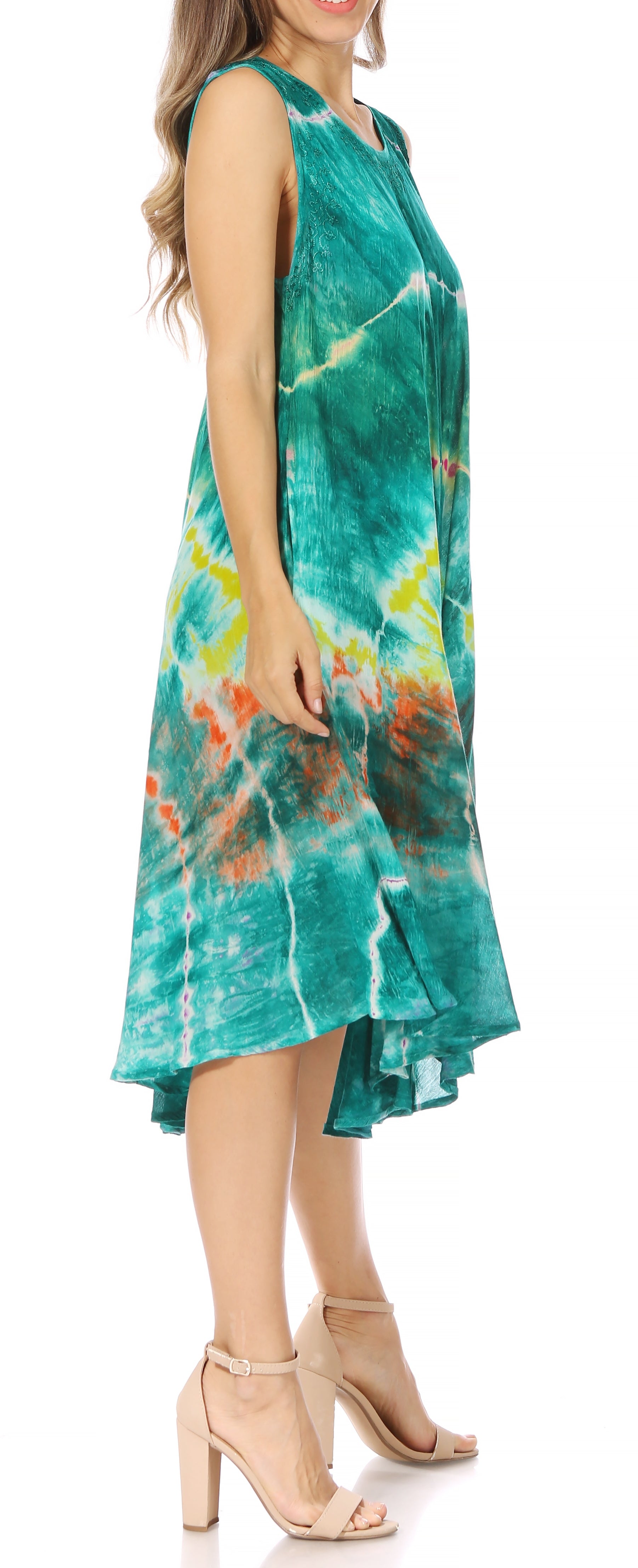 Woman wearing a tie-dye dress with a white background