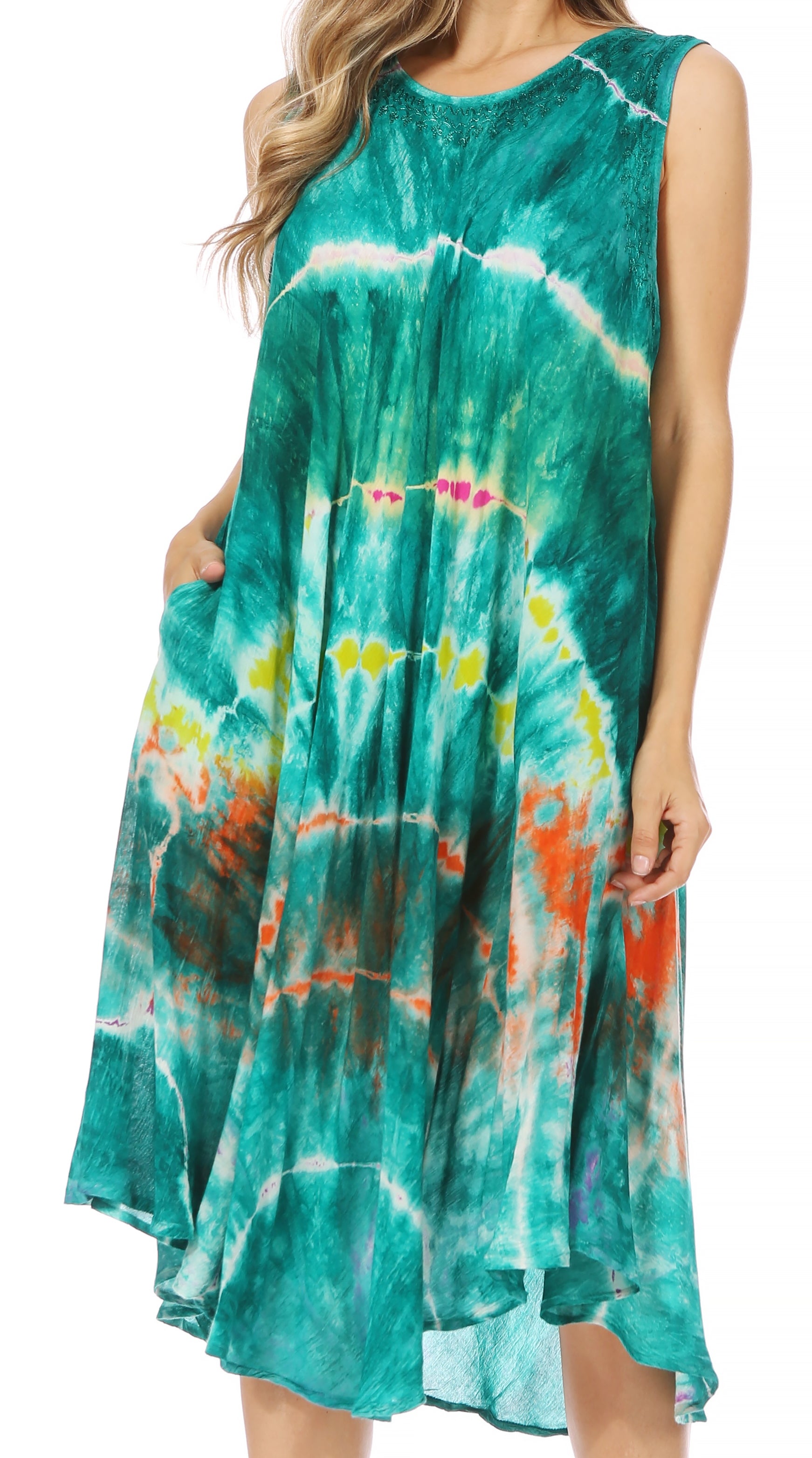 Woman wearing a tie-dye dress with a multicolor pattern on a white background
