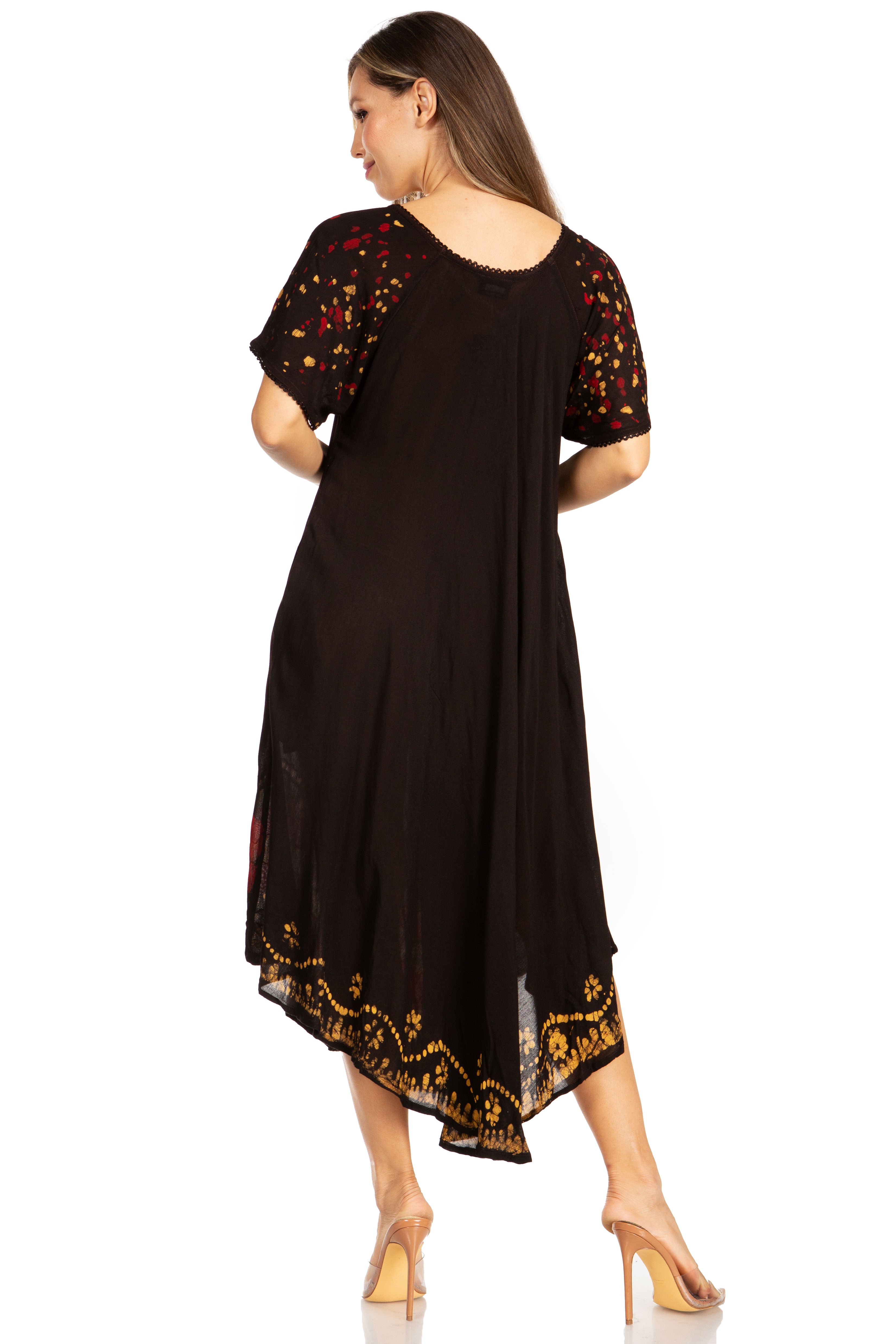 Woman wearing a black dress with gold embroidery on a white background
