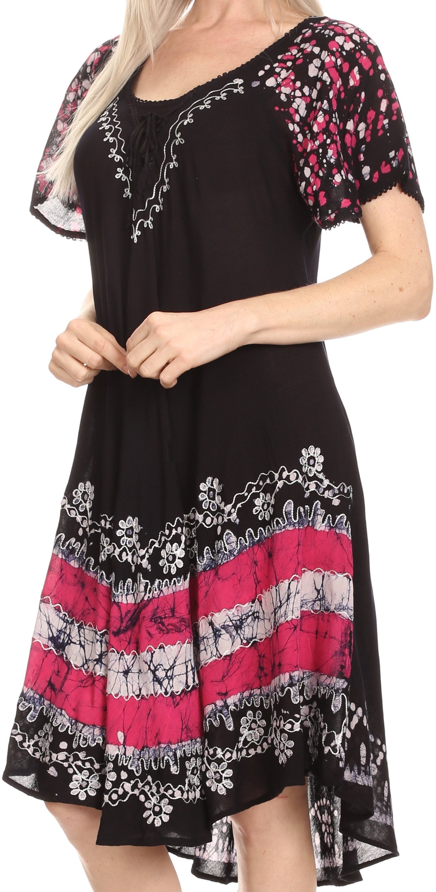 Black dress with pink and white floral patterns worn by a person