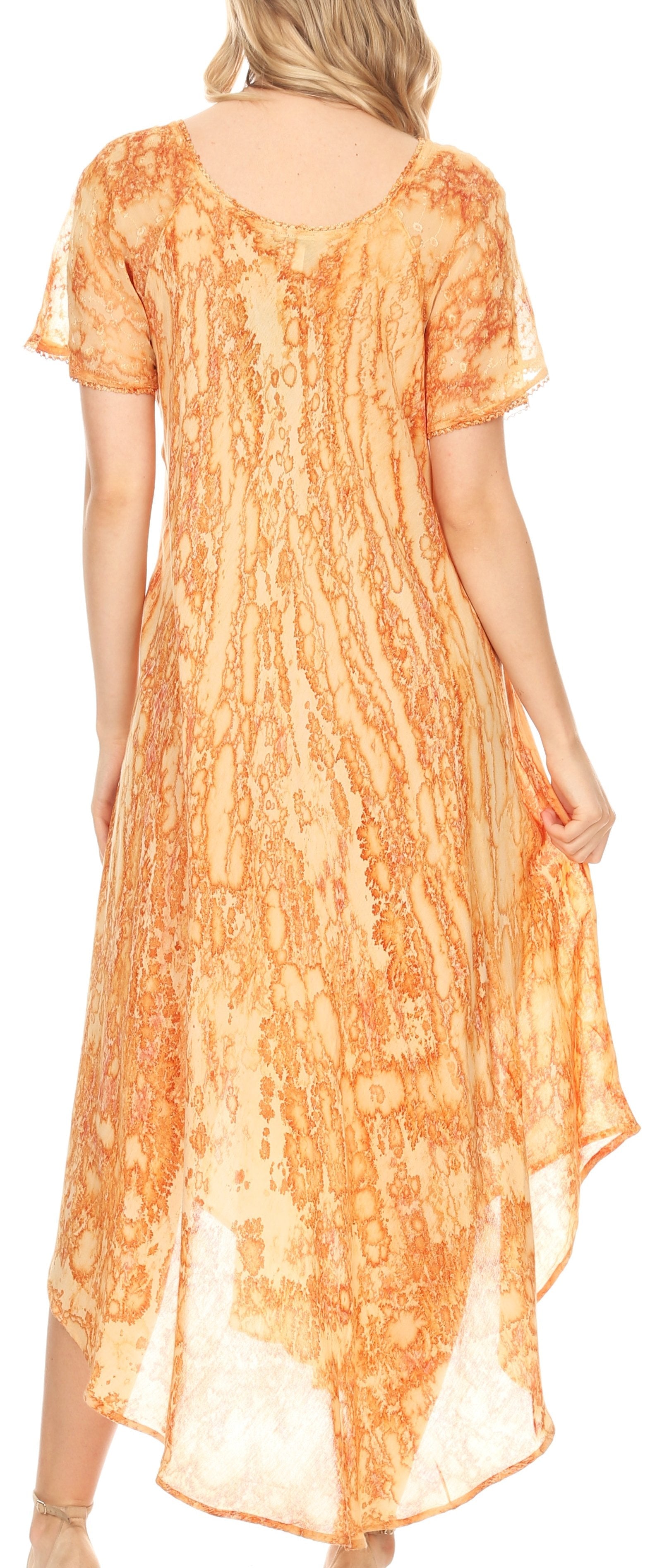 Orange patterned dress worn by a model on a white background