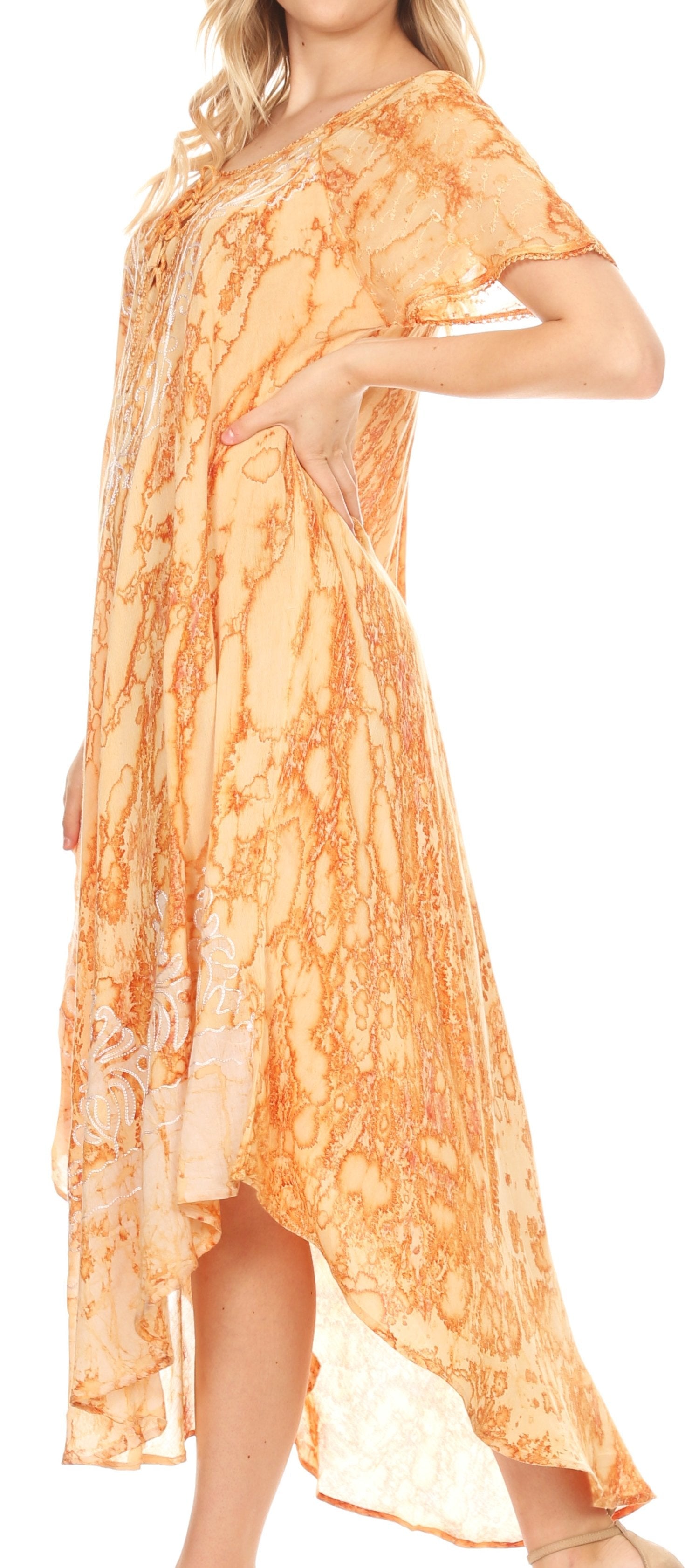 Orange patterned dress worn by a model on a white background
