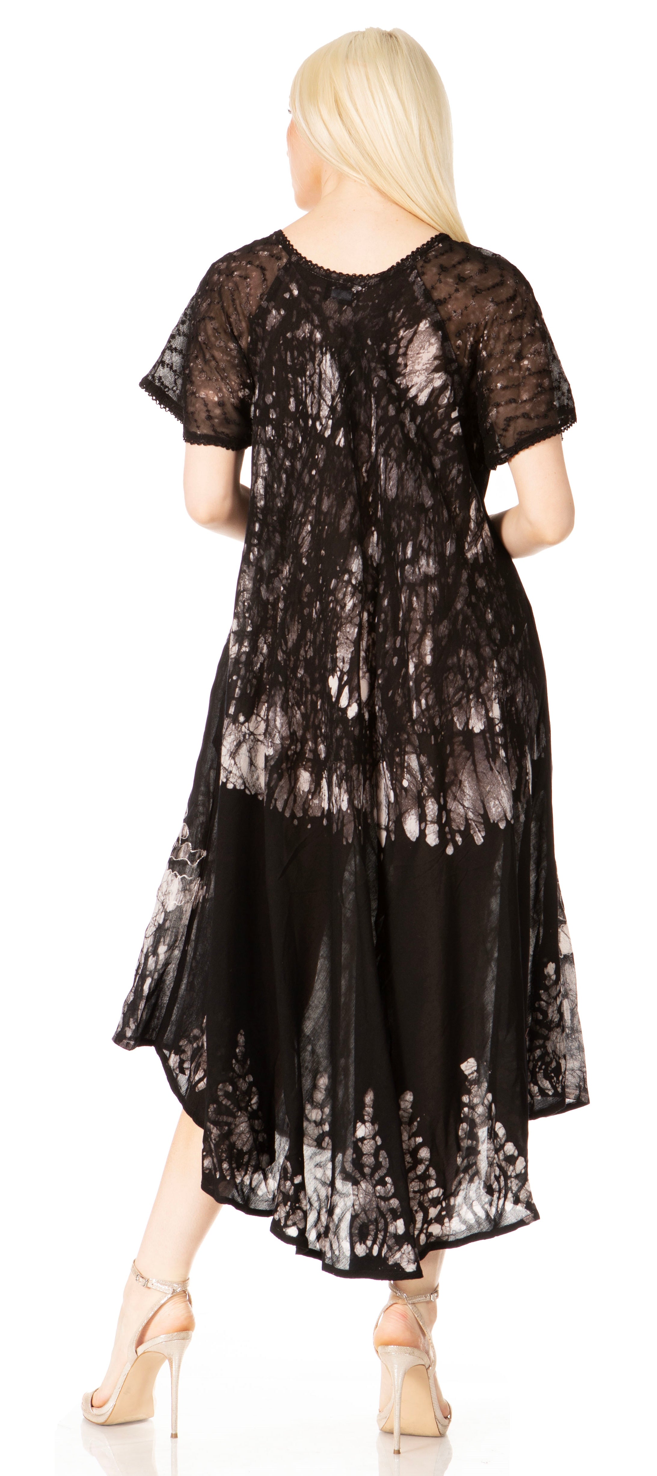 Black lace dress worn by a model on a white background