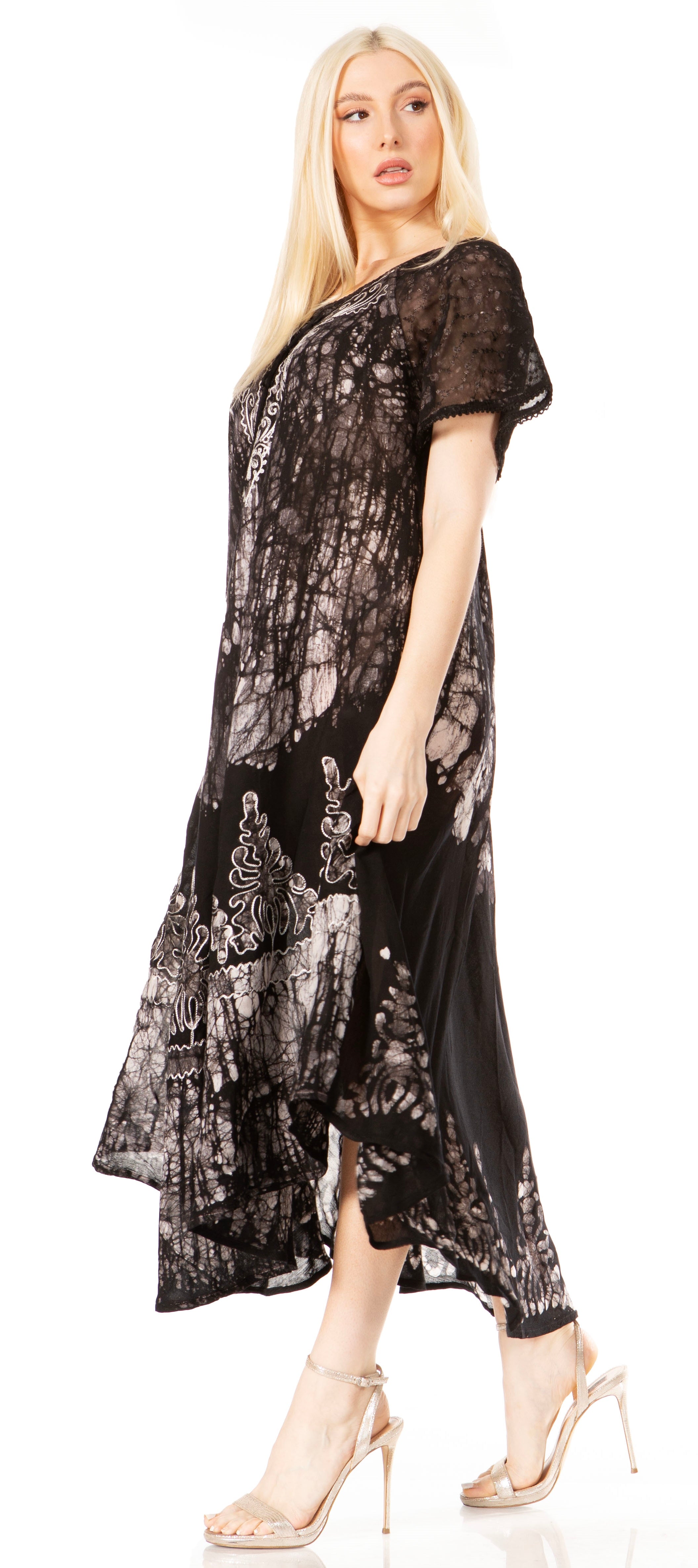 Woman wearing a black lace dress on a white background