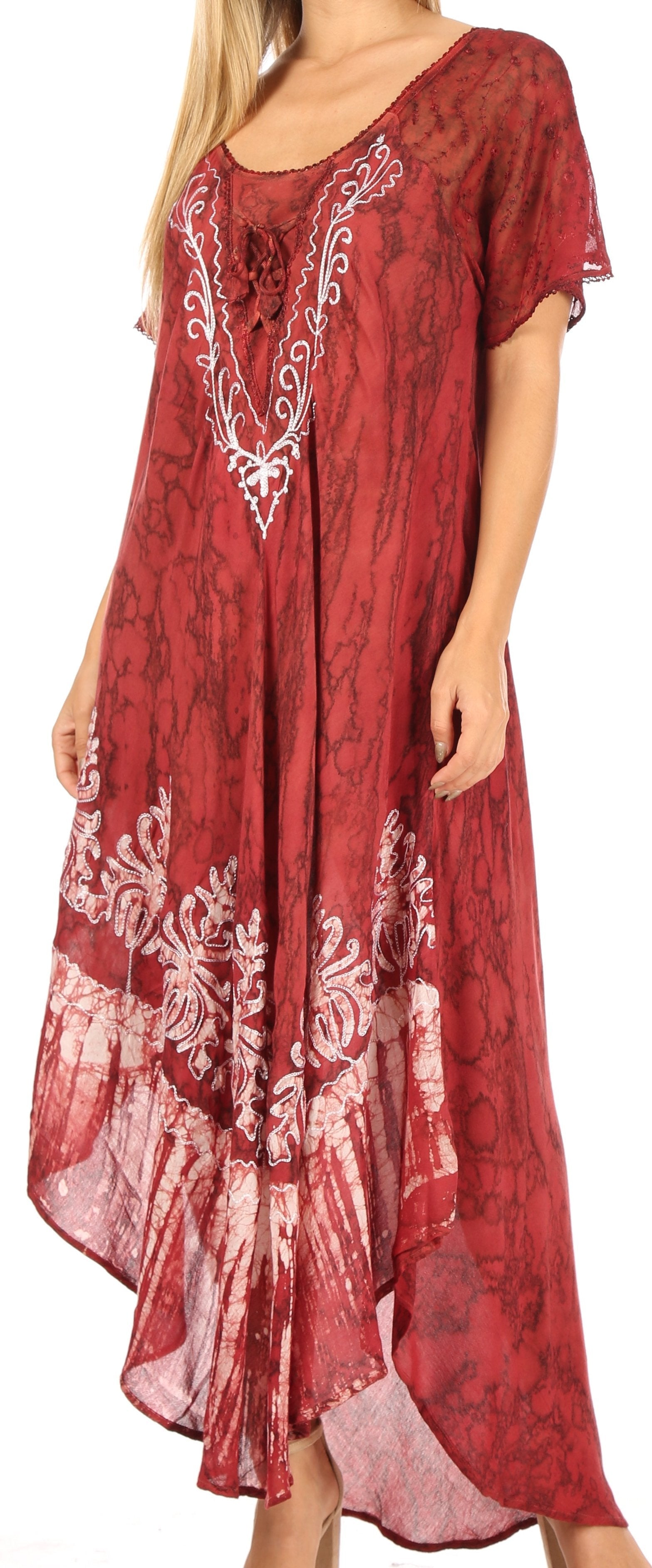 Red dress with white floral embroidery worn by a person