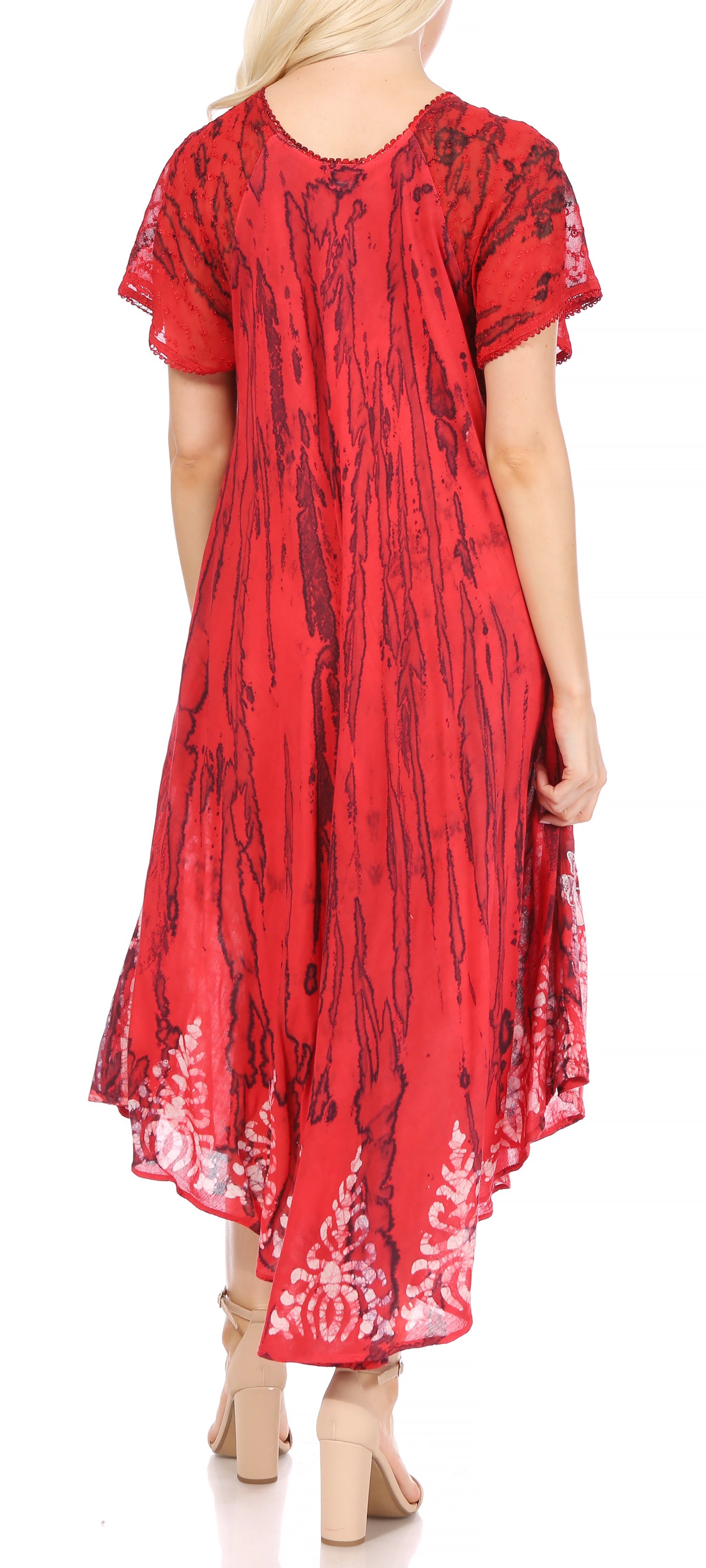 Red dress with black patterns worn by a person on a white background