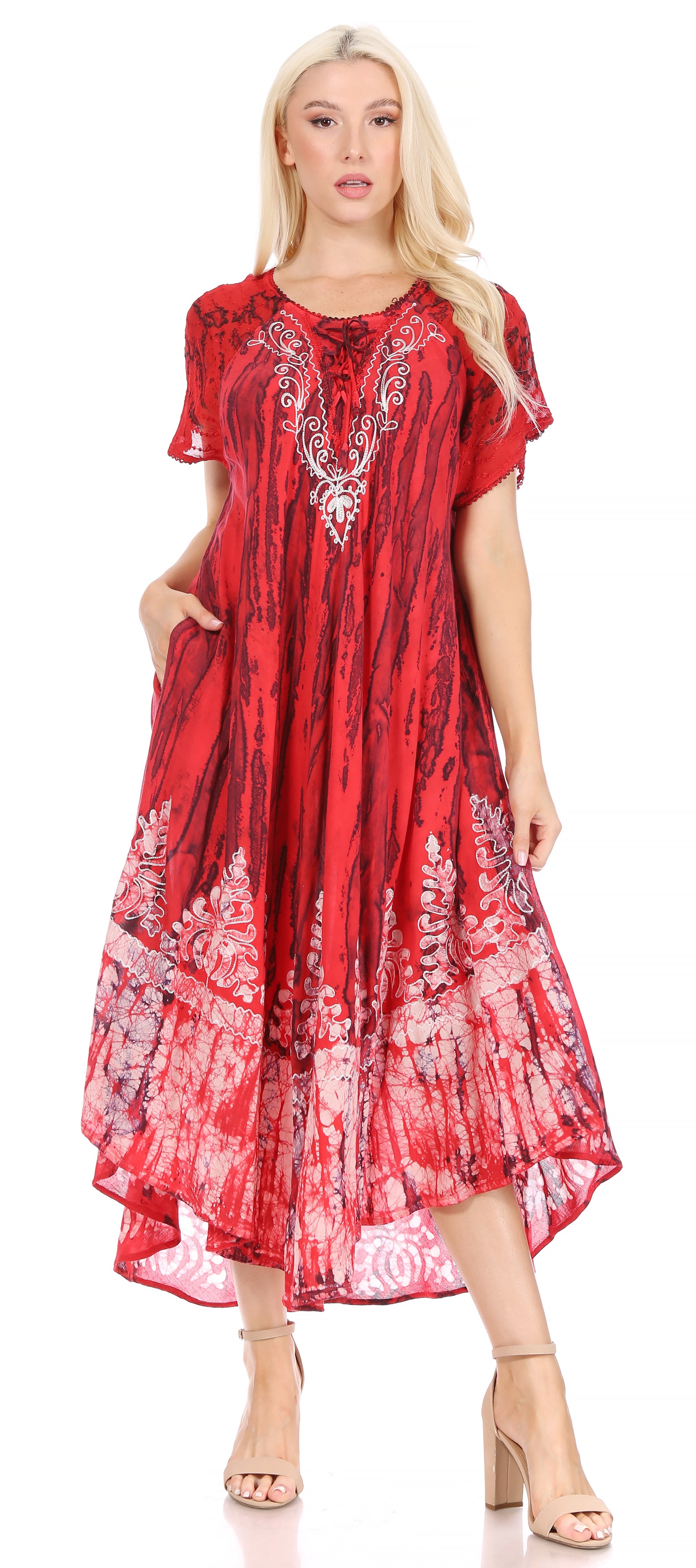 Woman wearing a red dress with white patterns on a white background