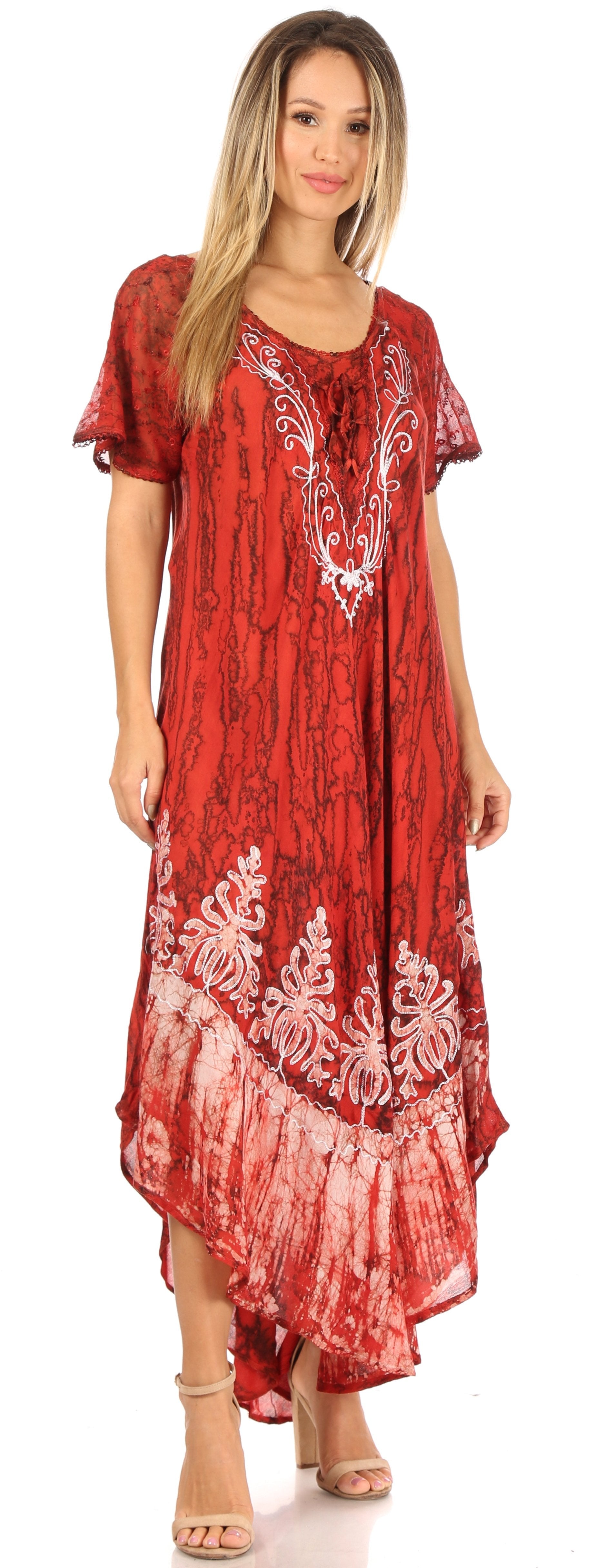 Woman wearing a red patterned dress on a white background