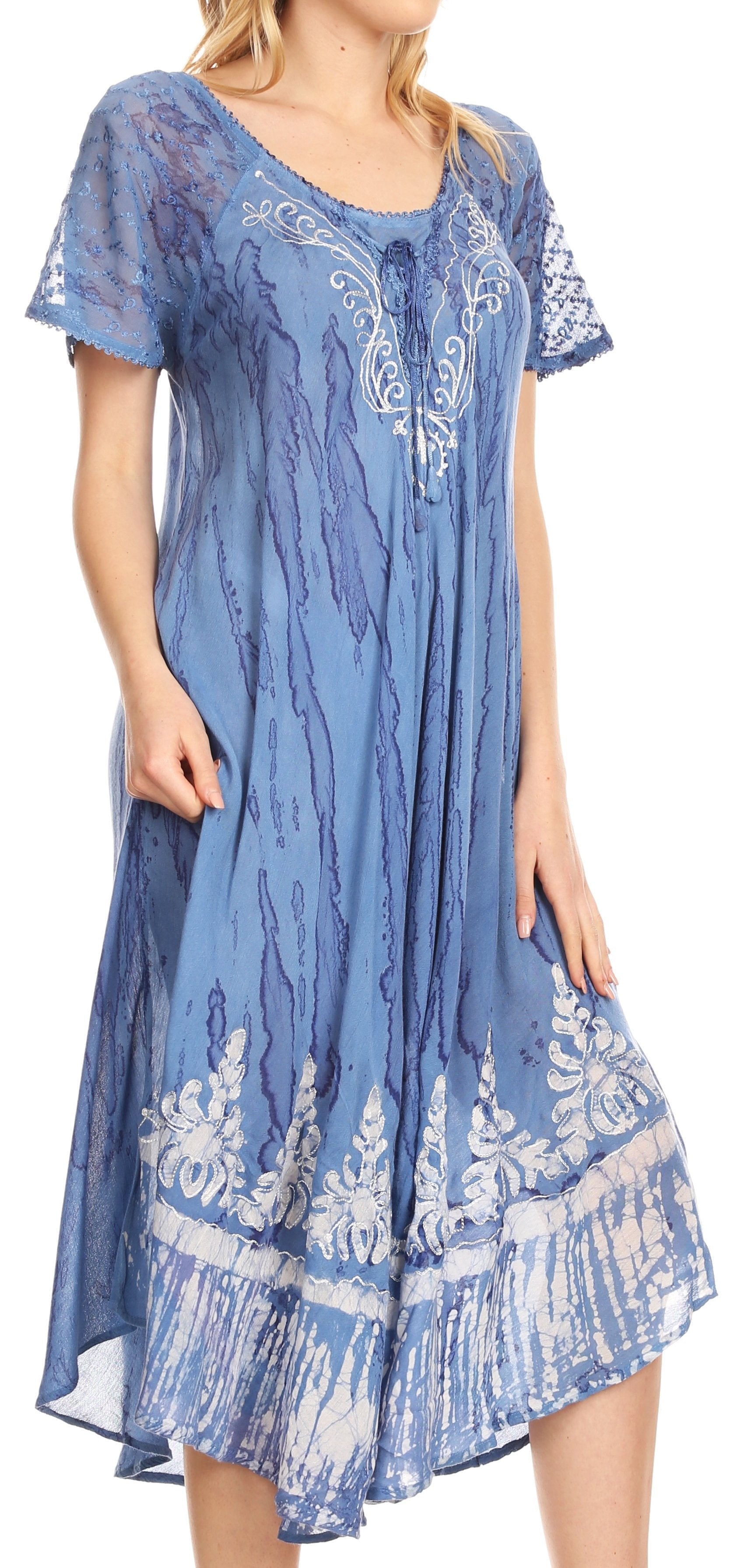 Woman wearing a blue patterned dress on a white background