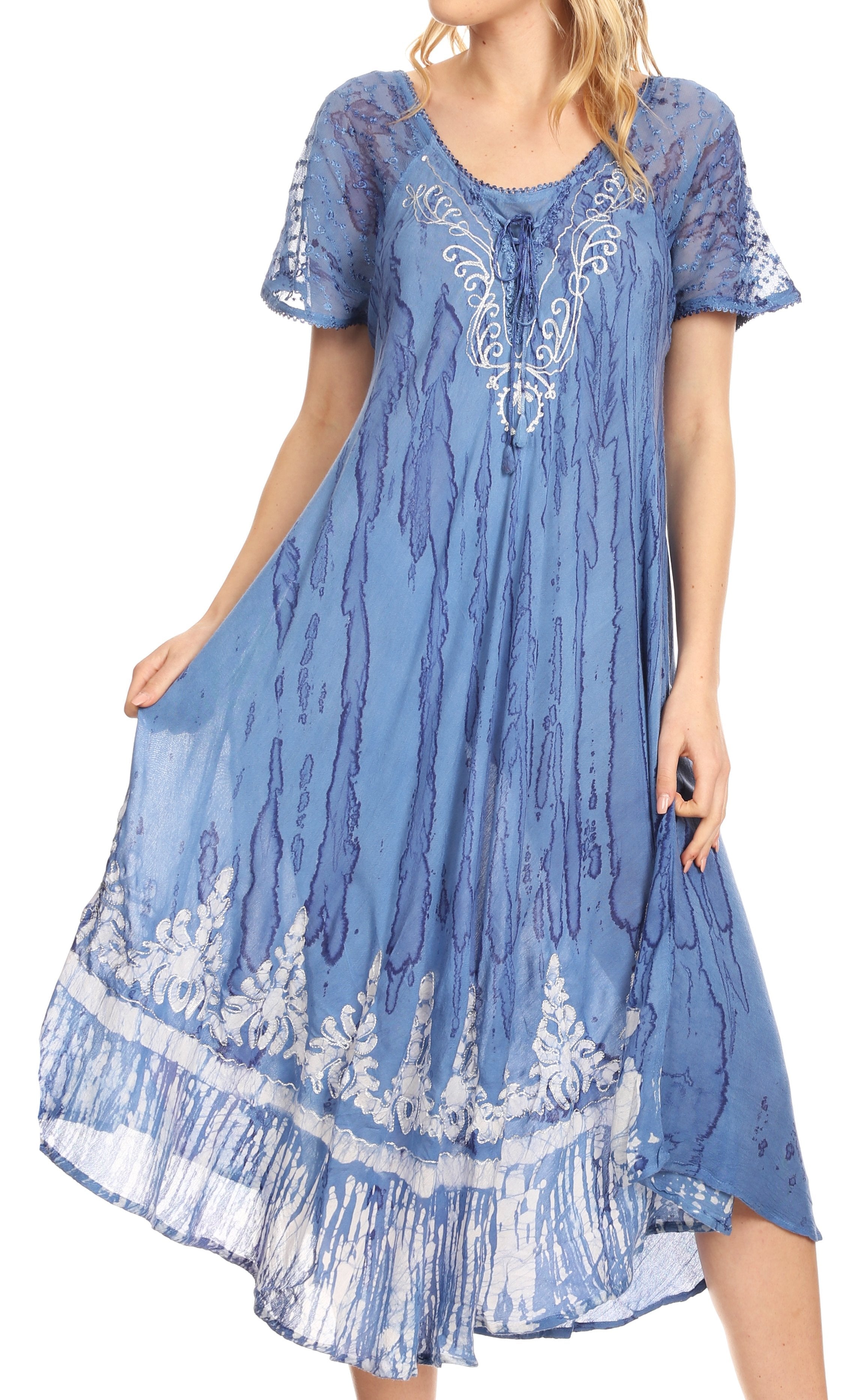 Blue embroidered dress with white patterns on a plain background
