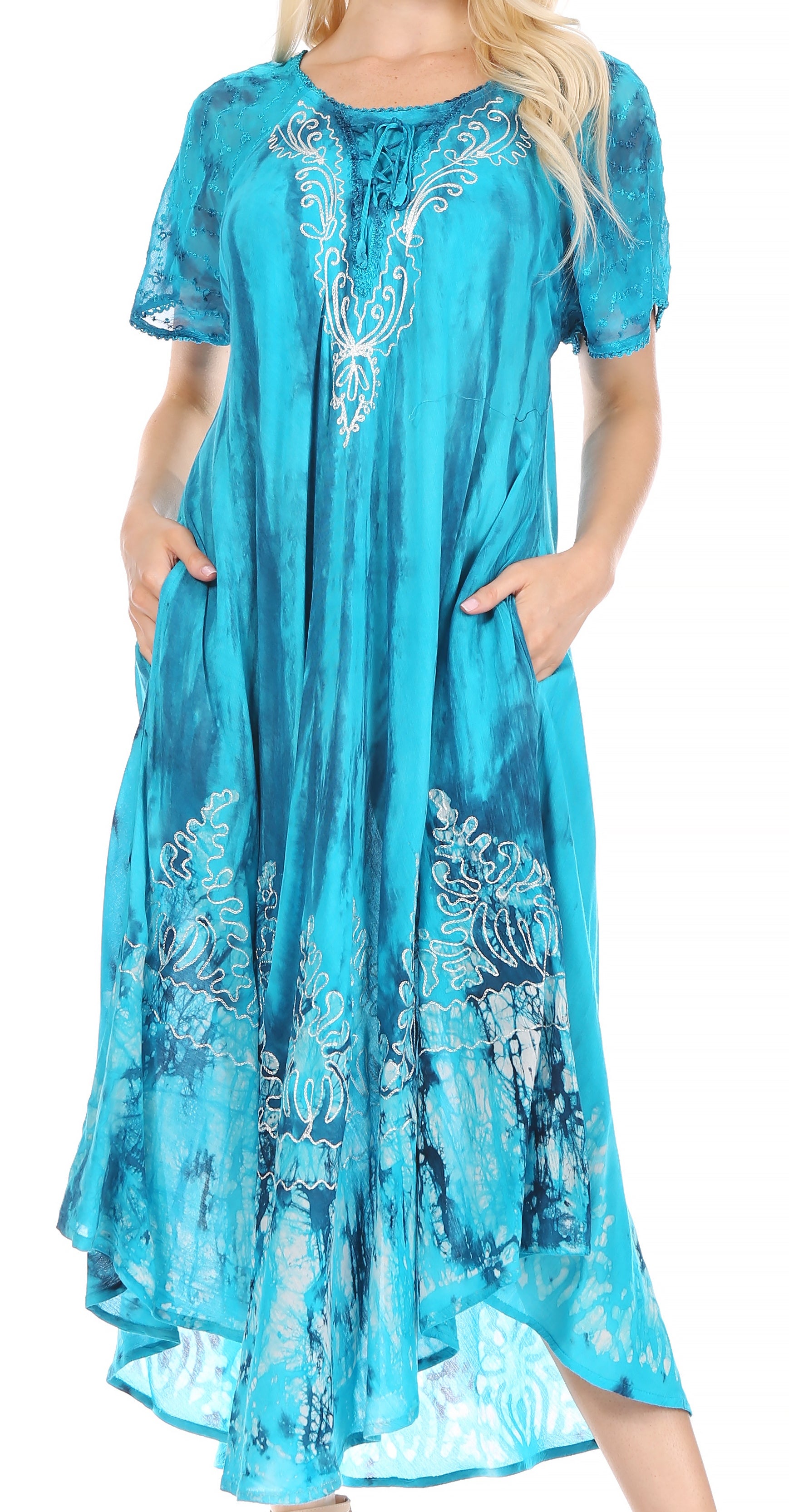 Turquoise dress with floral embroidery on a white background