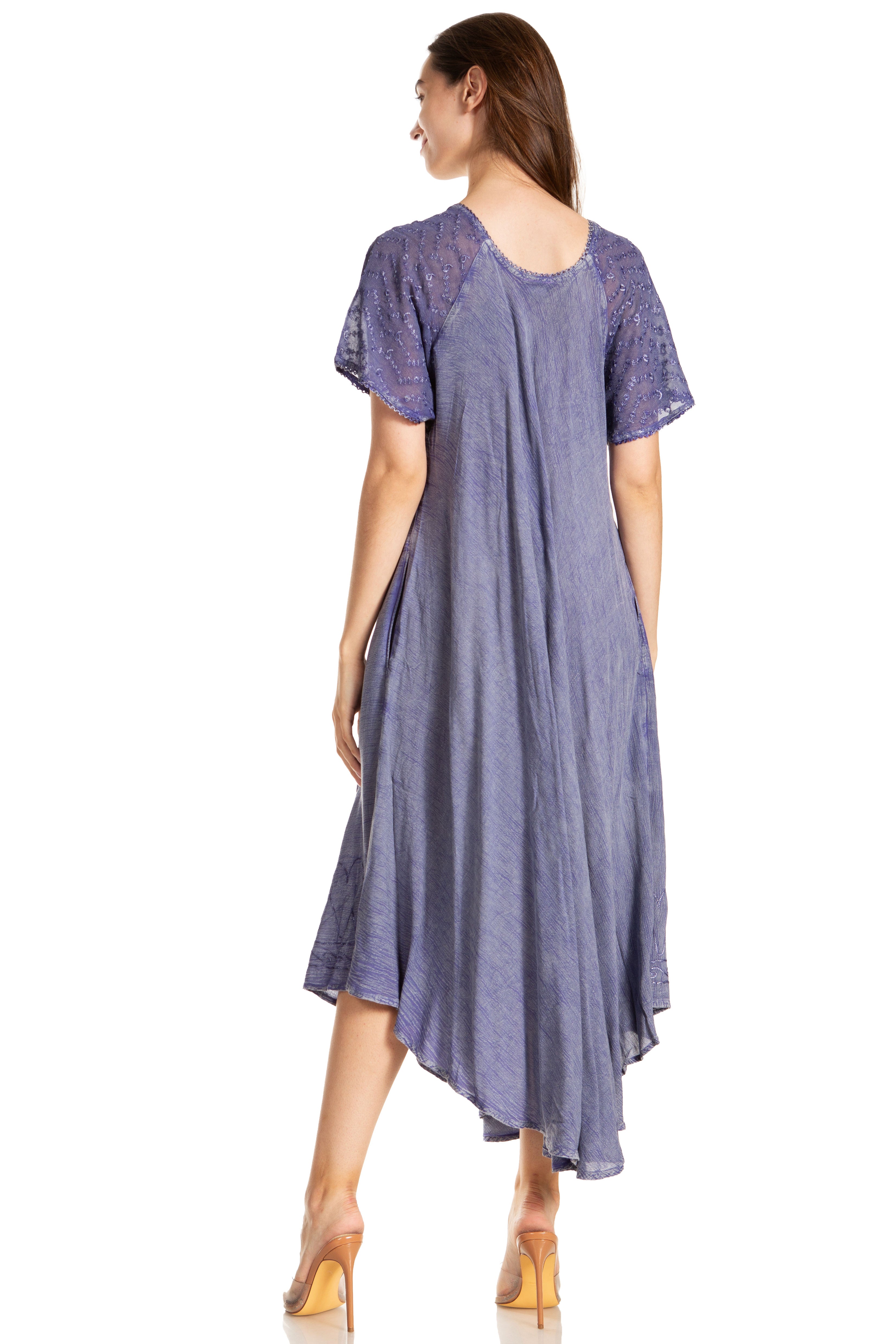 Woman wearing a long, flowing purple dress on a white background