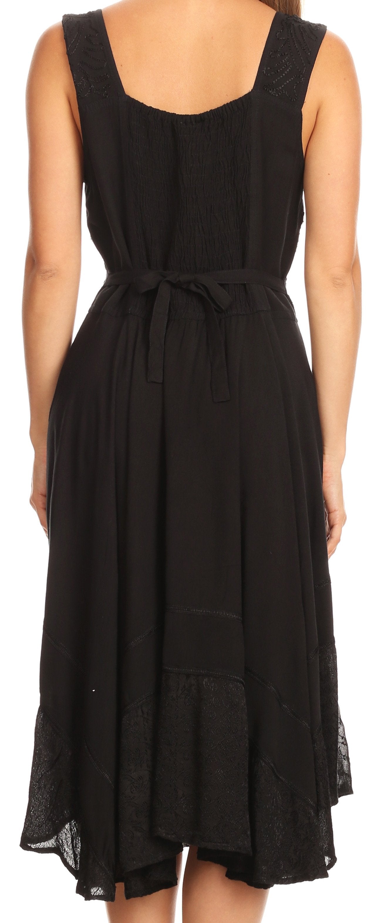 Black sleeveless dress with a tie waist on a person