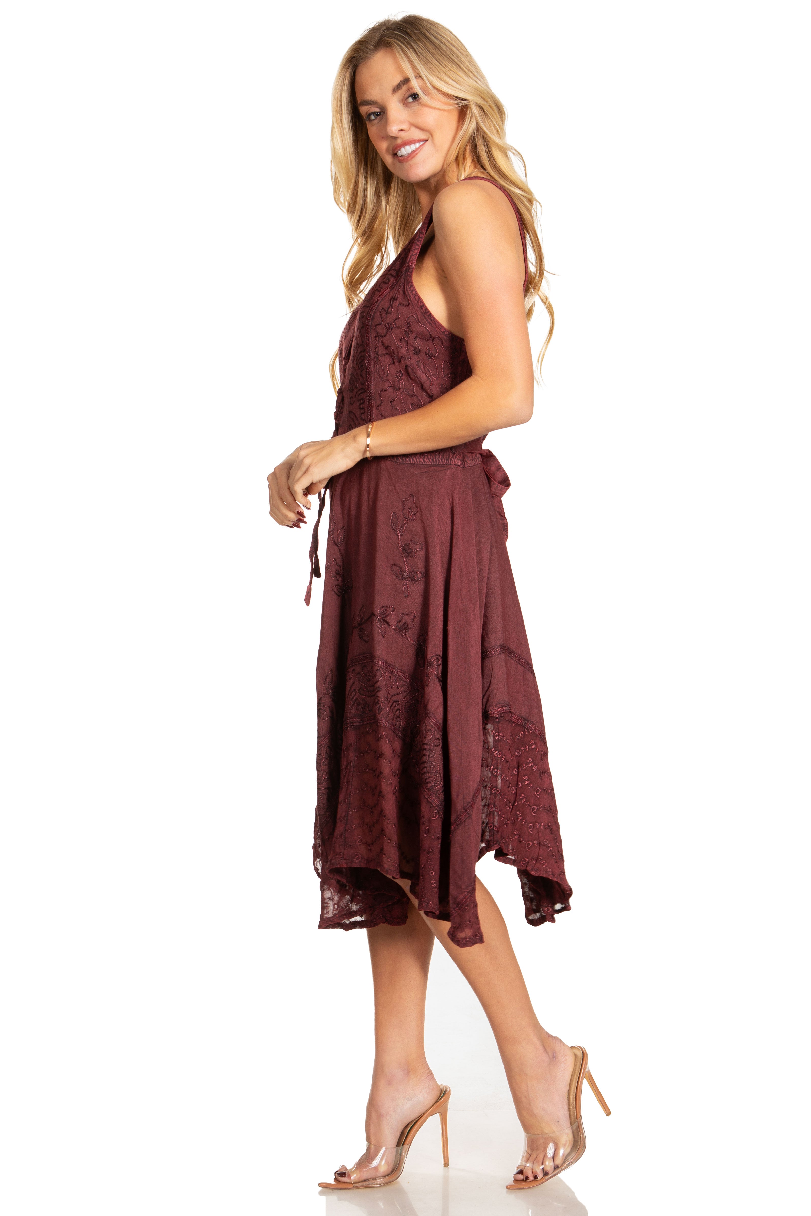 Woman wearing a burgundy lace dress on a white background