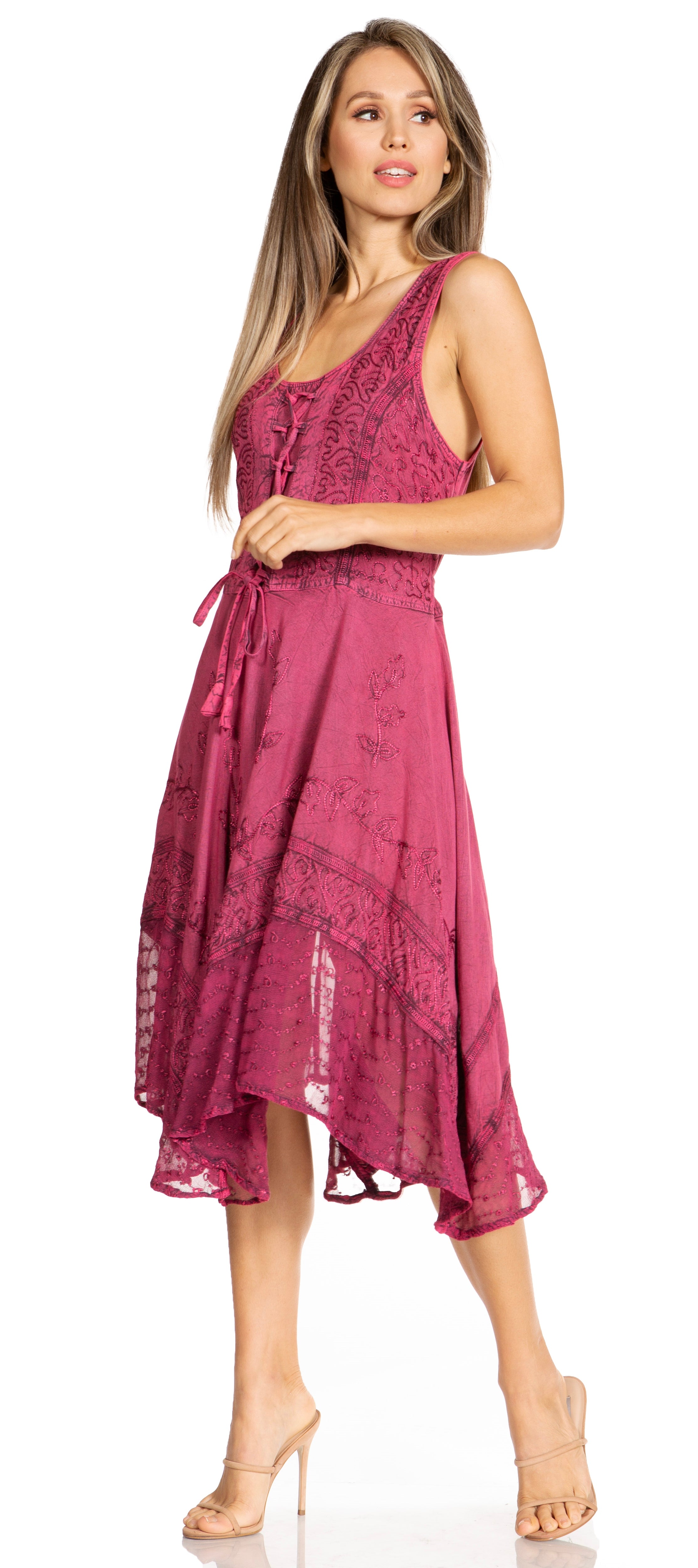 Woman wearing a pink lace dress on a white background