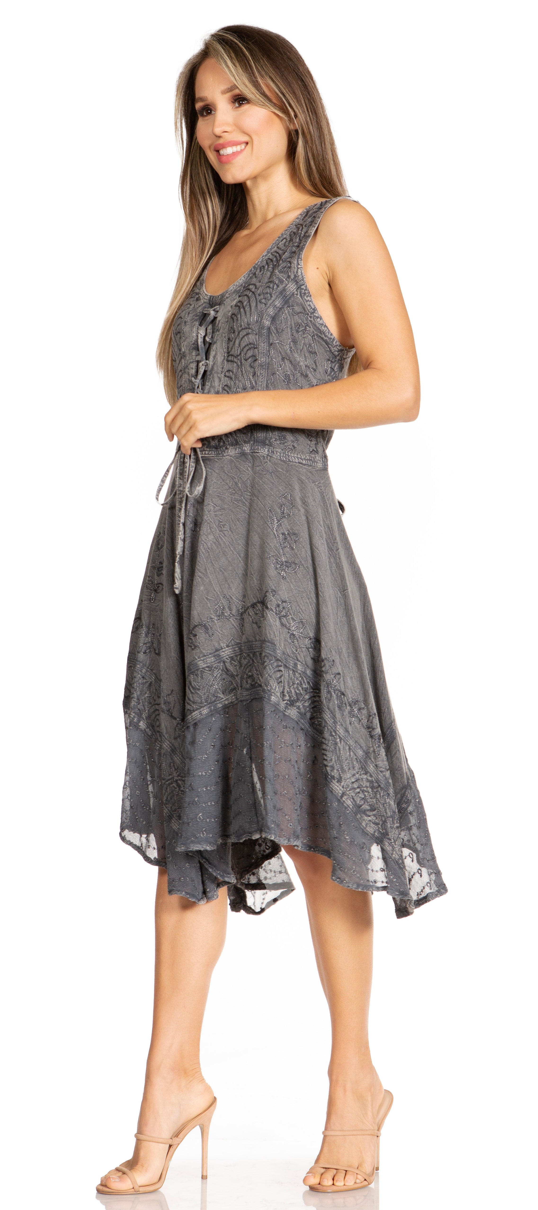 Woman wearing a gray lace dress on a white background