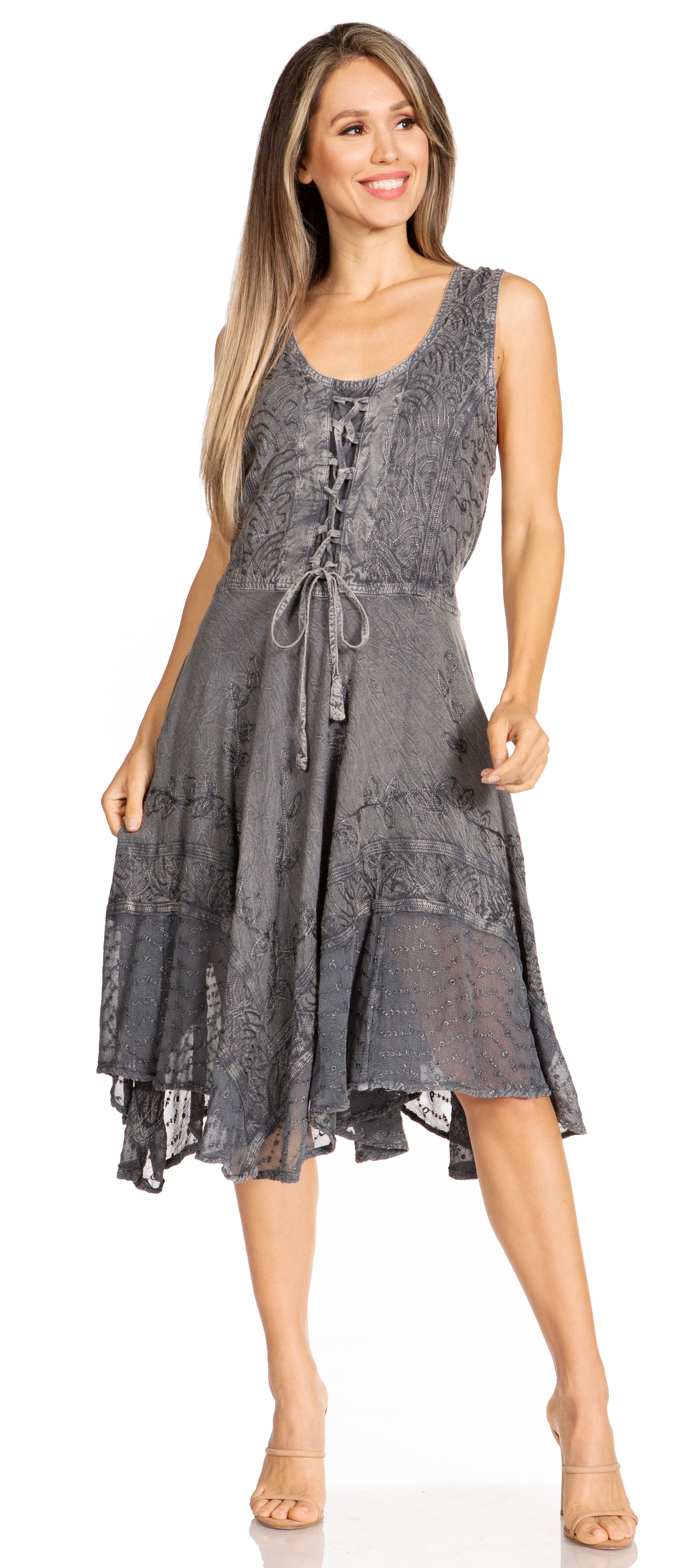Woman wearing a sleeveless, patterned dress on a white background