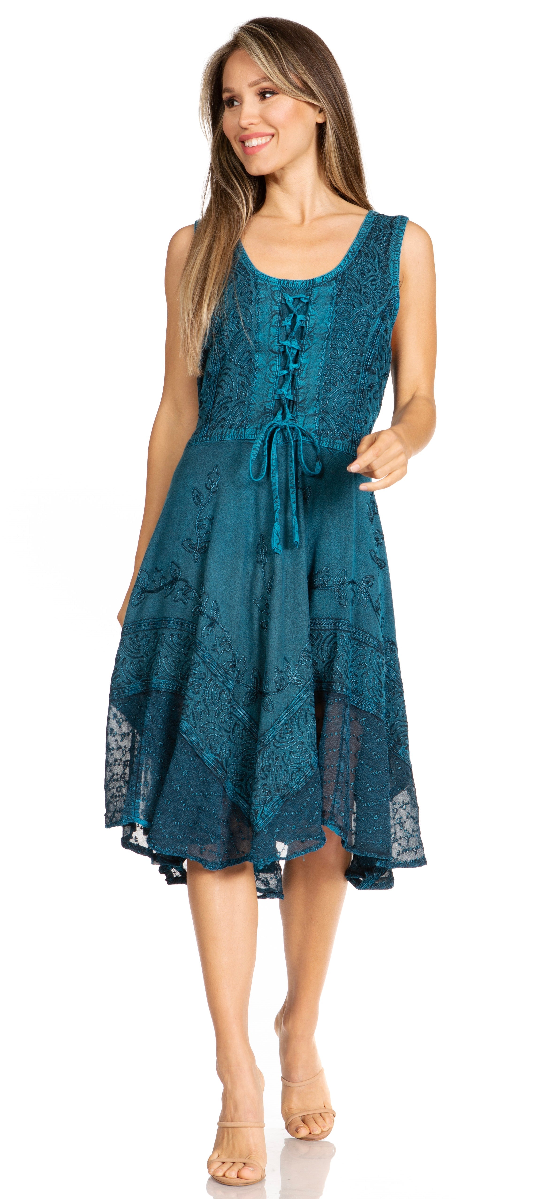 Woman wearing a teal lace dress on a white background