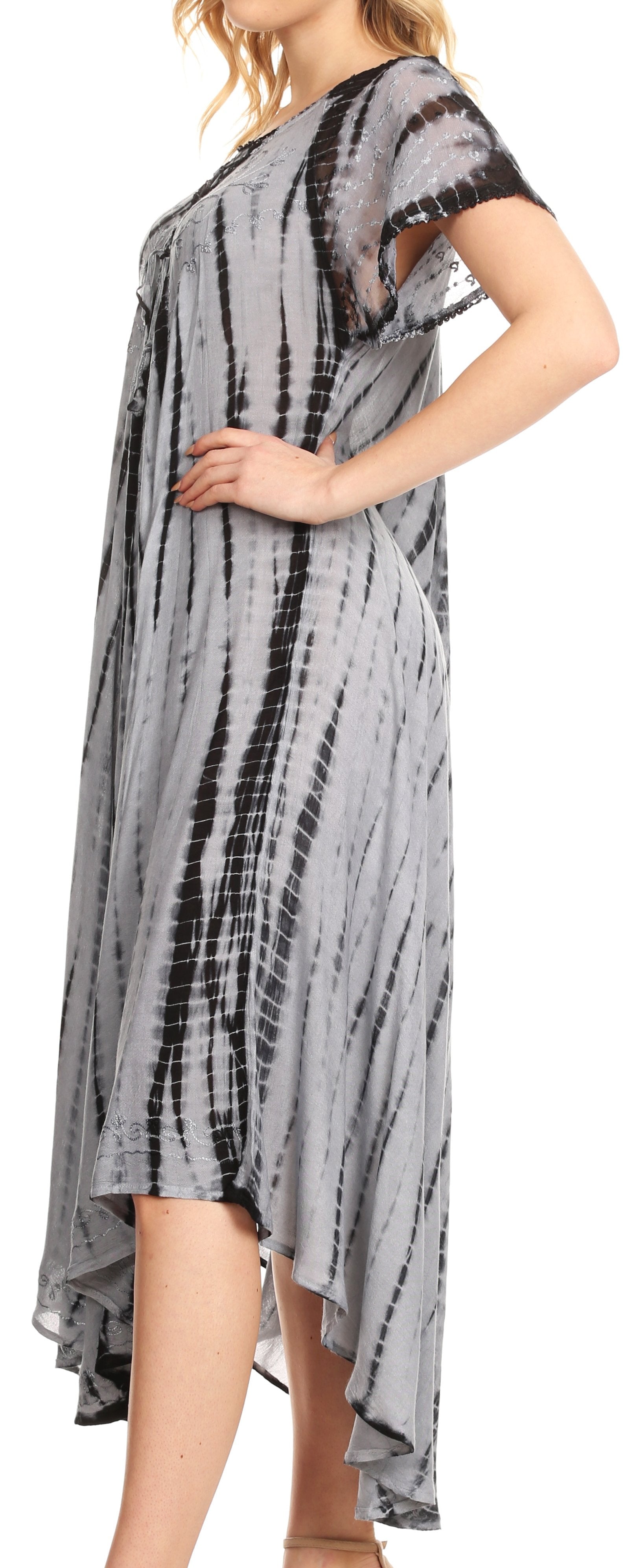 Woman wearing a tie-dye dress with black and gray patterns.