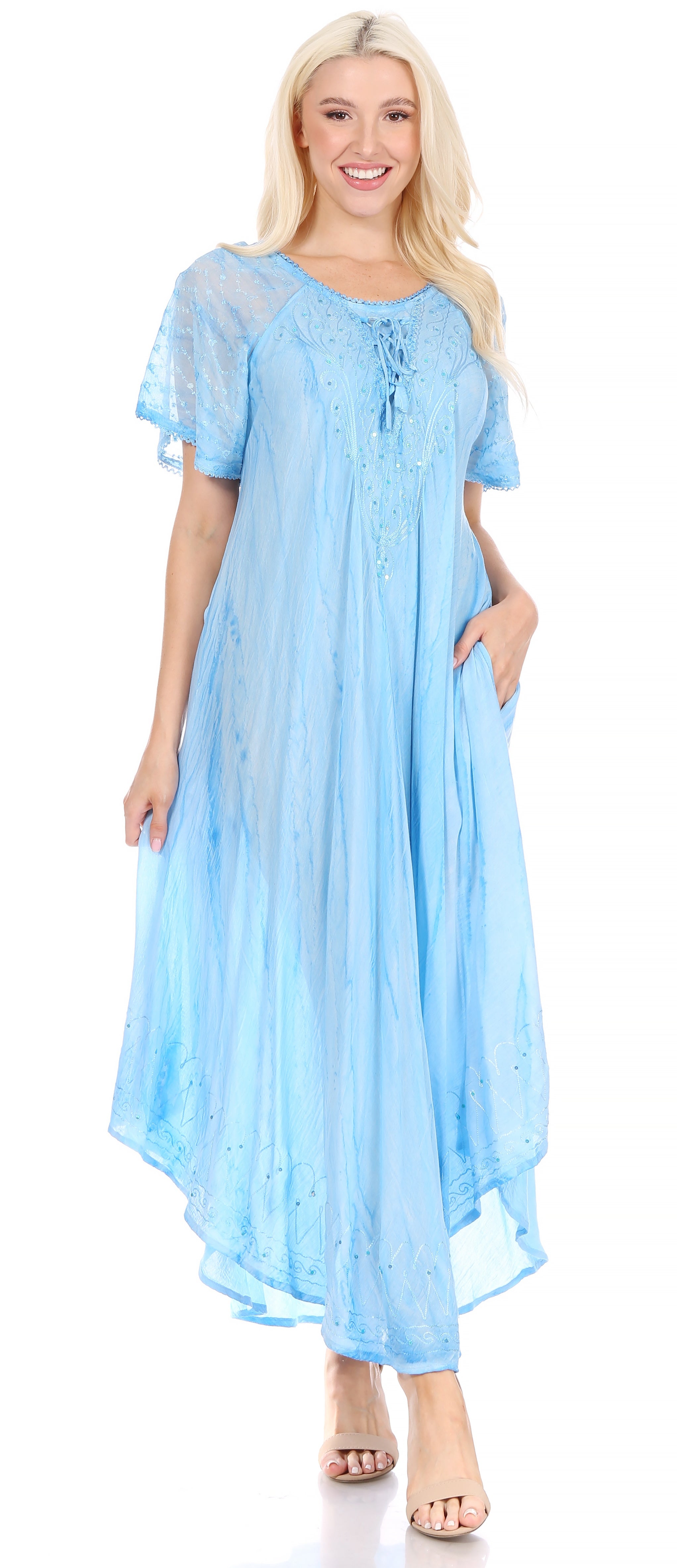 Woman wearing a light blue dress with a white background