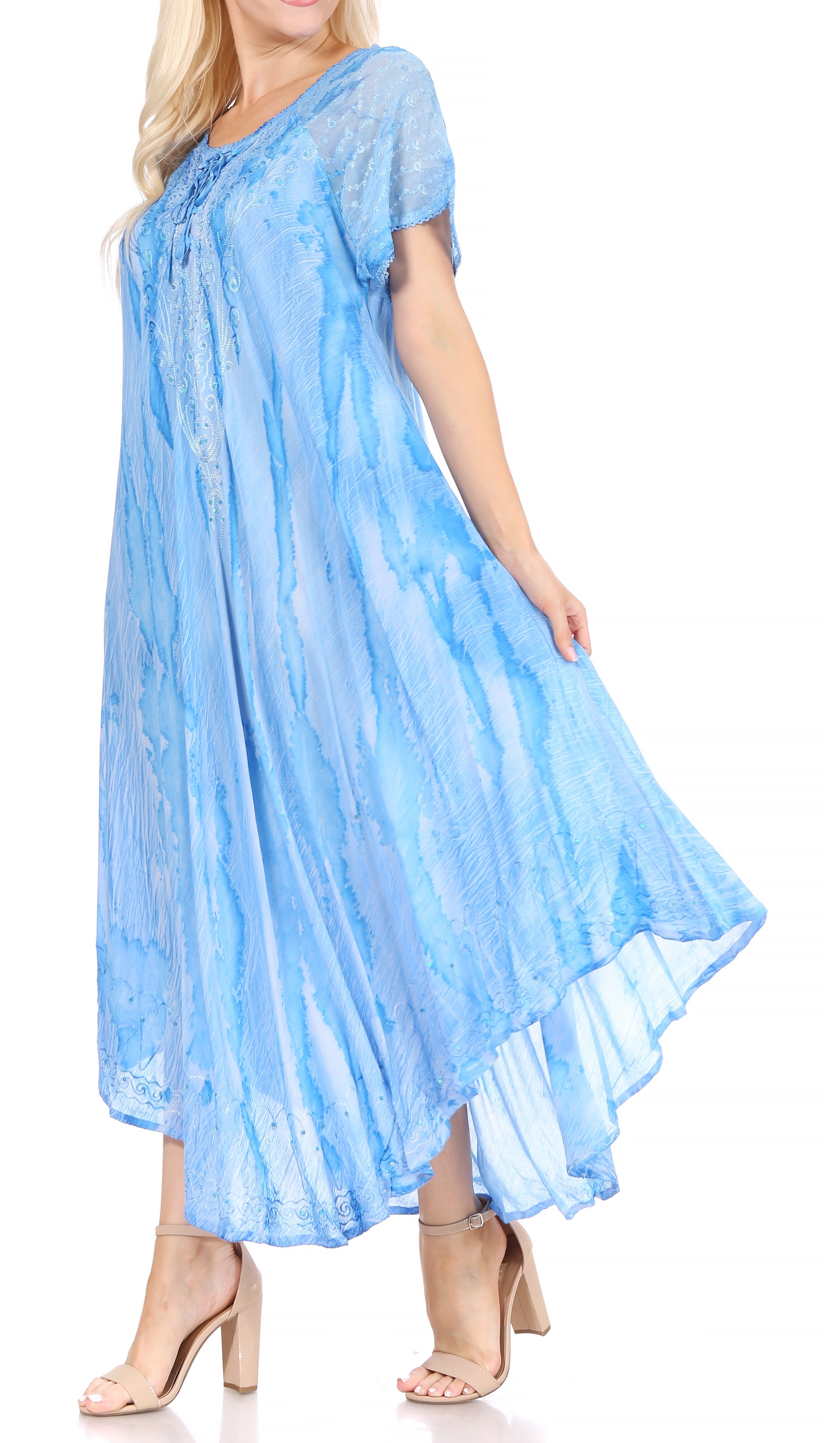 Woman wearing a light blue dress with a white background