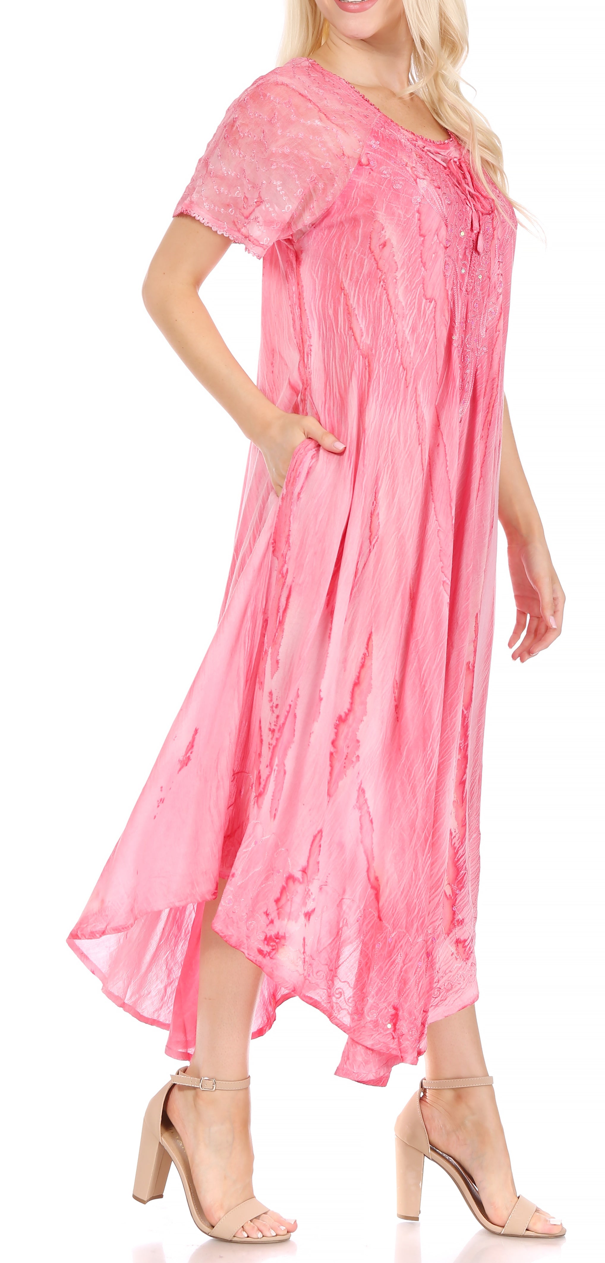 Woman wearing a pink dress on a white background
