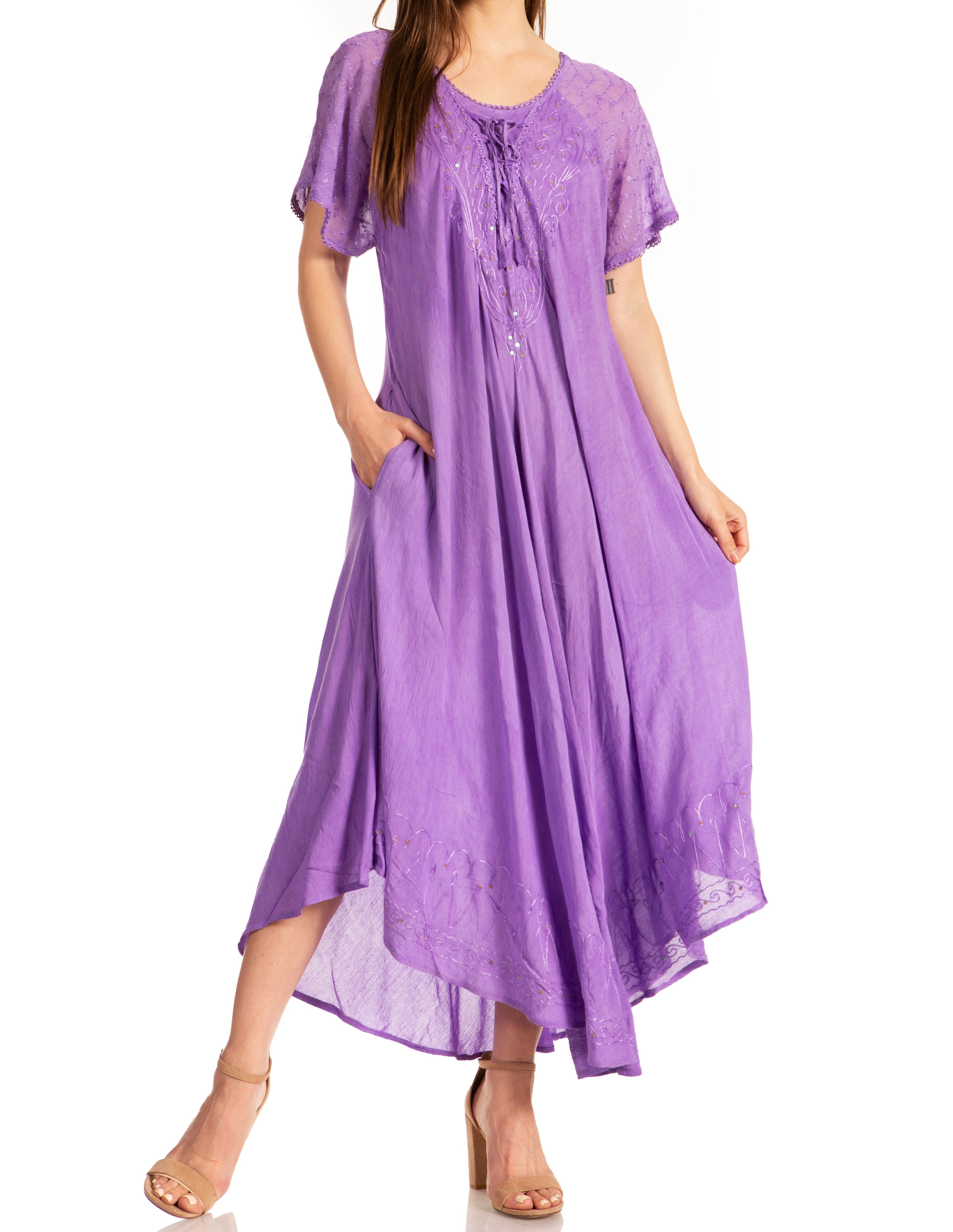 Woman wearing a purple dress with a white background