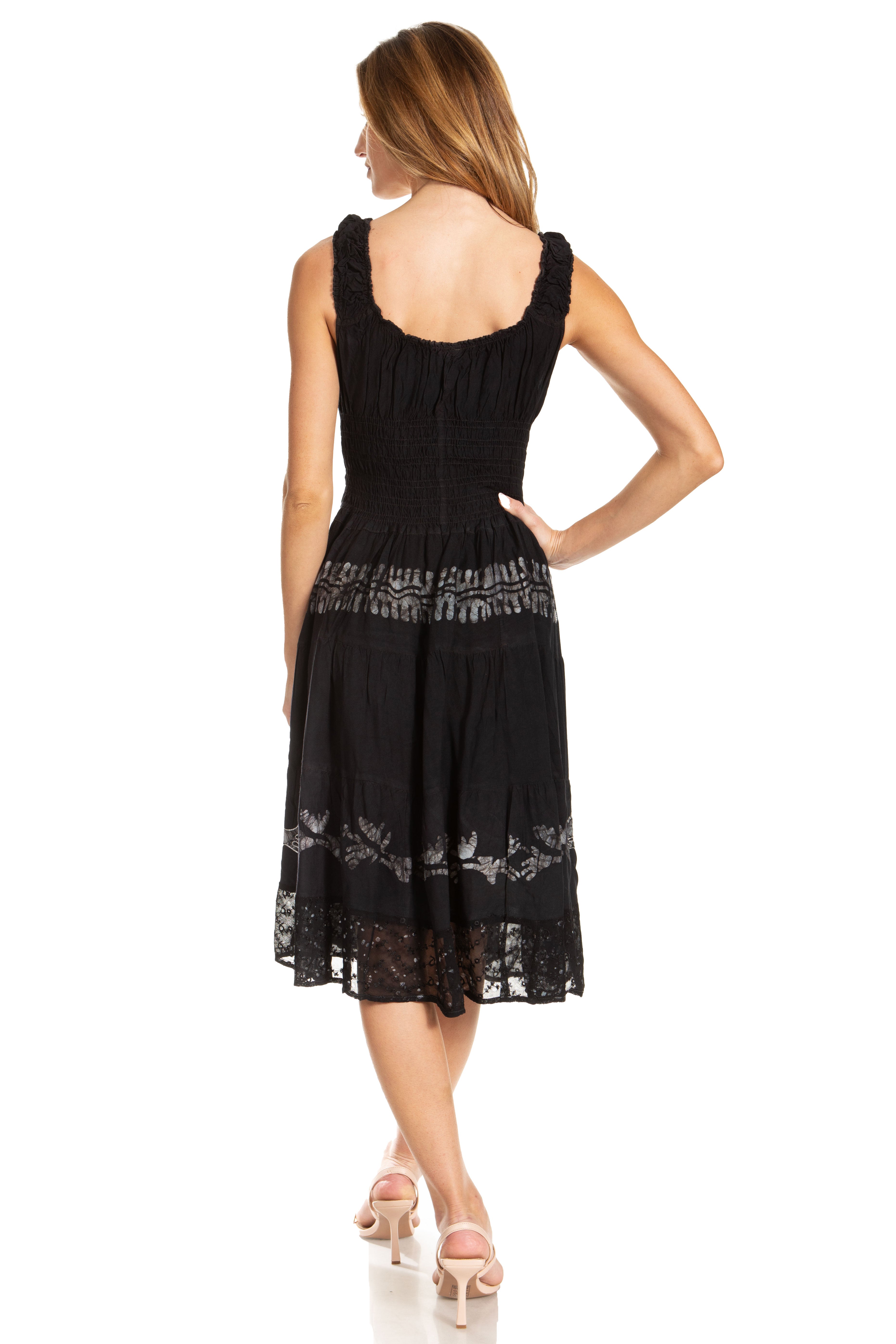 Black dress with lace details on a white background
