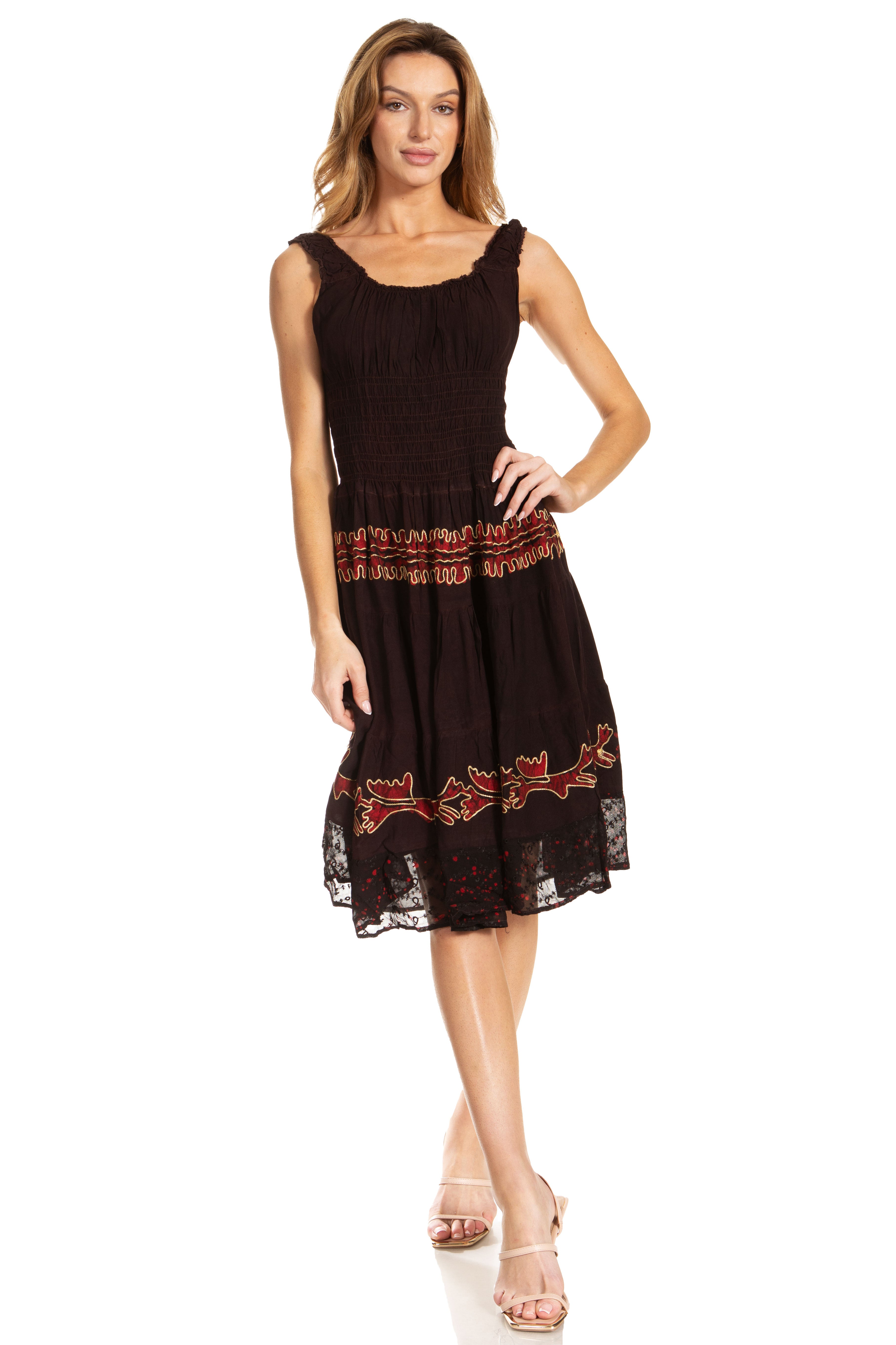 Woman wearing a black dress with red embroidery on a white background