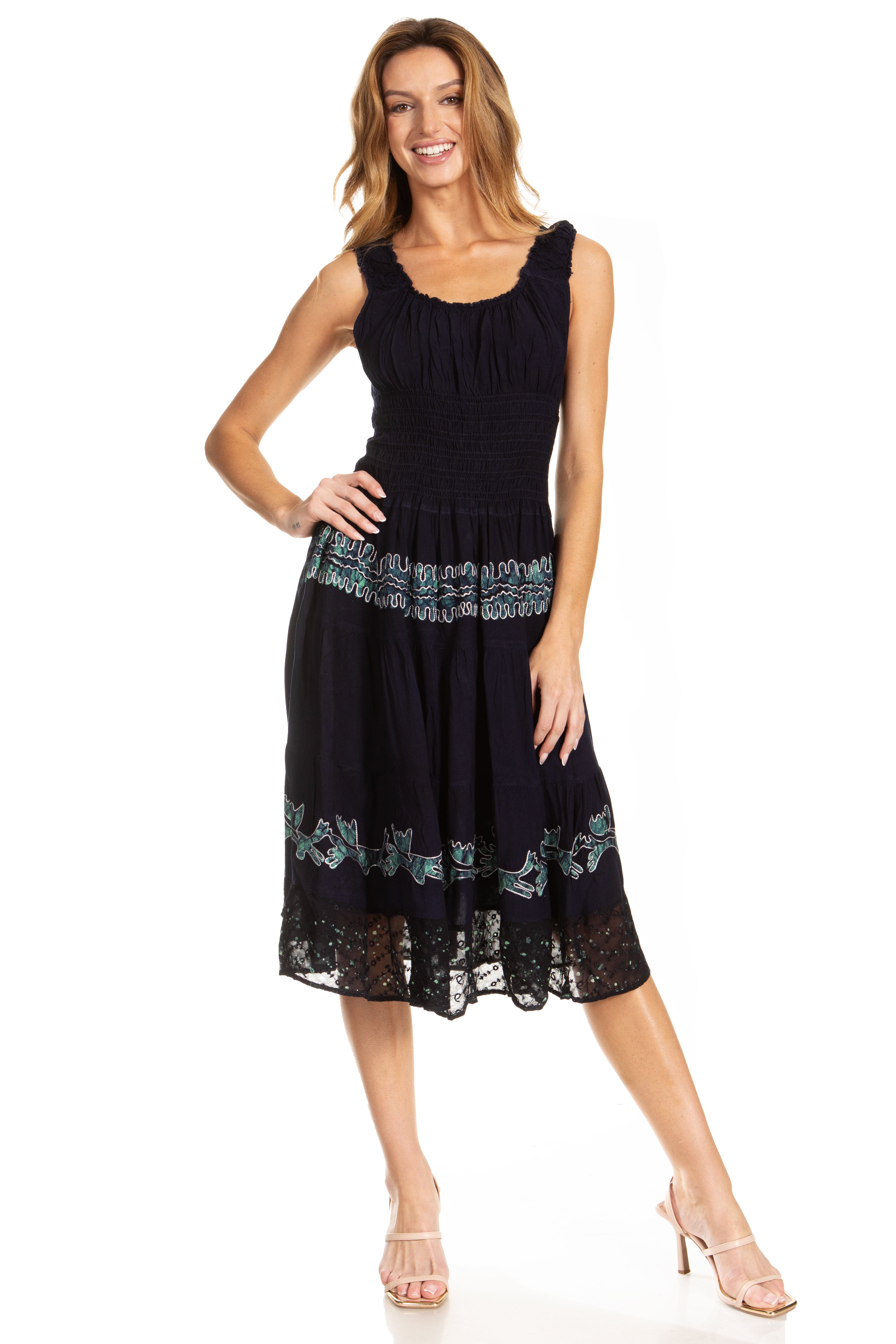 Woman wearing a black dress with lace details on a white background
