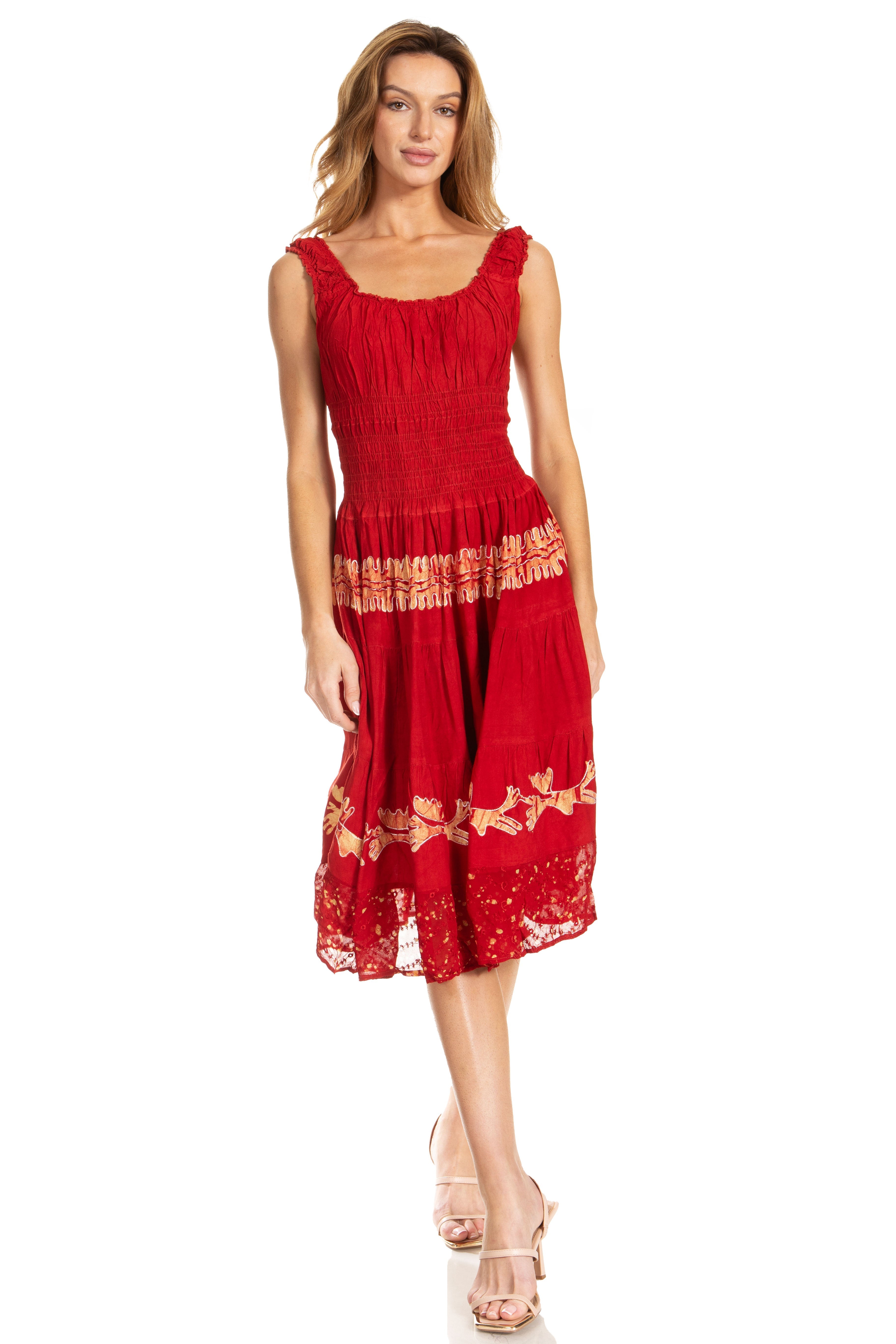 Woman wearing a red dress with floral lace details on a white background