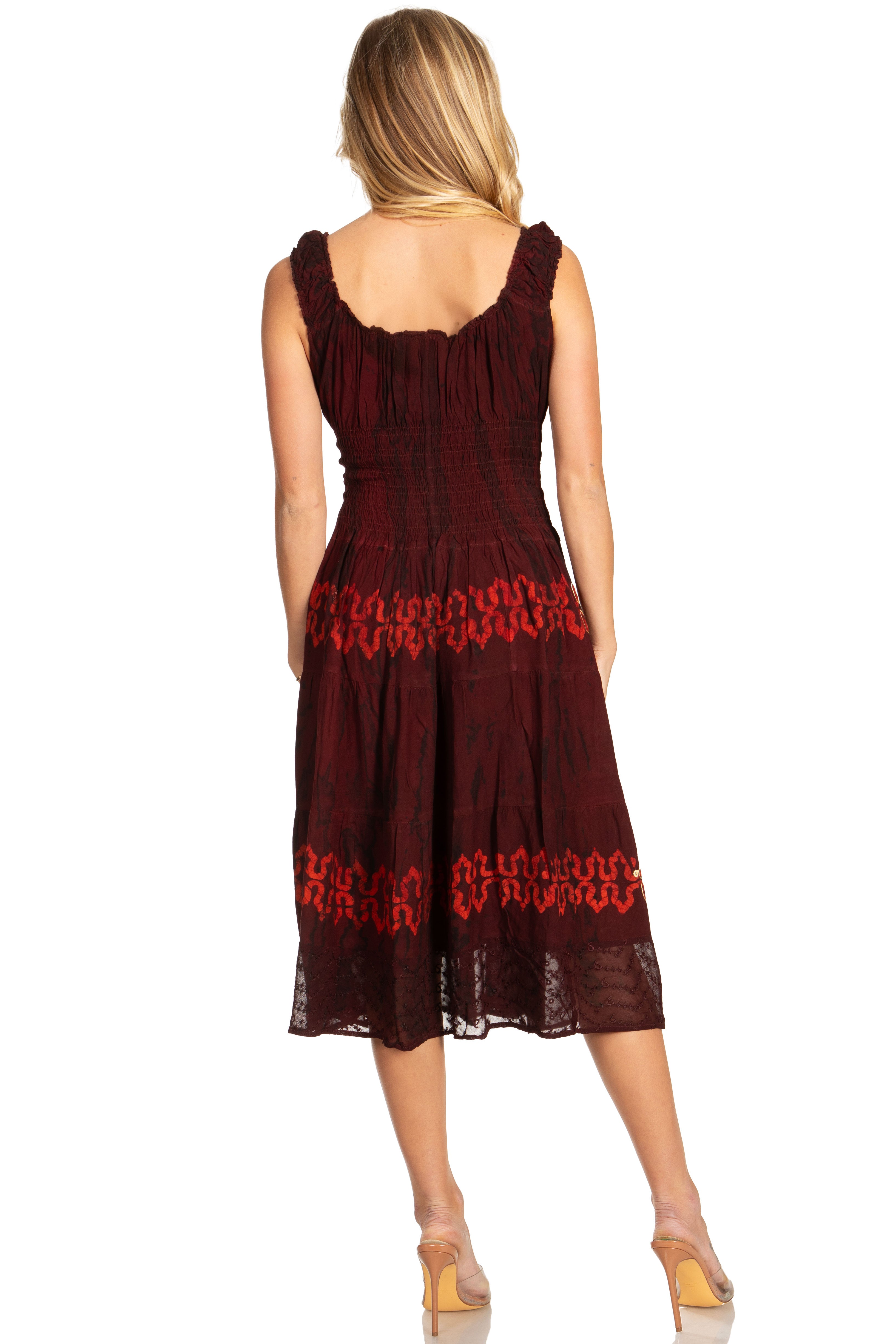 Woman wearing a burgundy dress with lace details on a white background