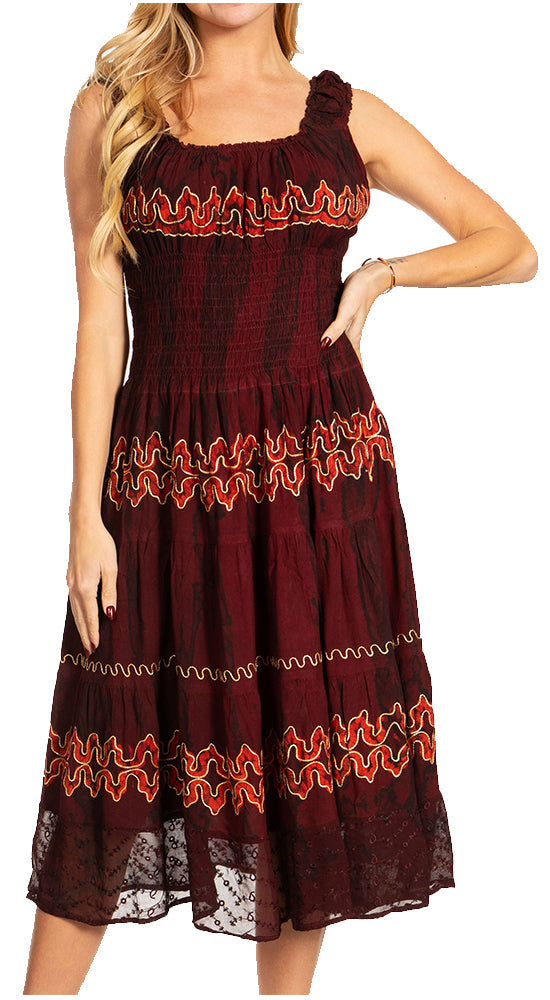Woman wearing a burgundy dress with red floral embroidery on a white background