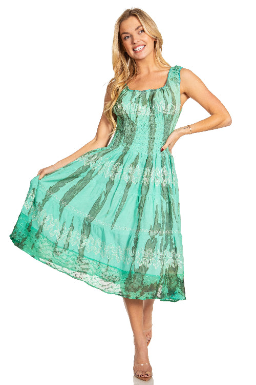 Woman wearing a green patterned dress on a white background