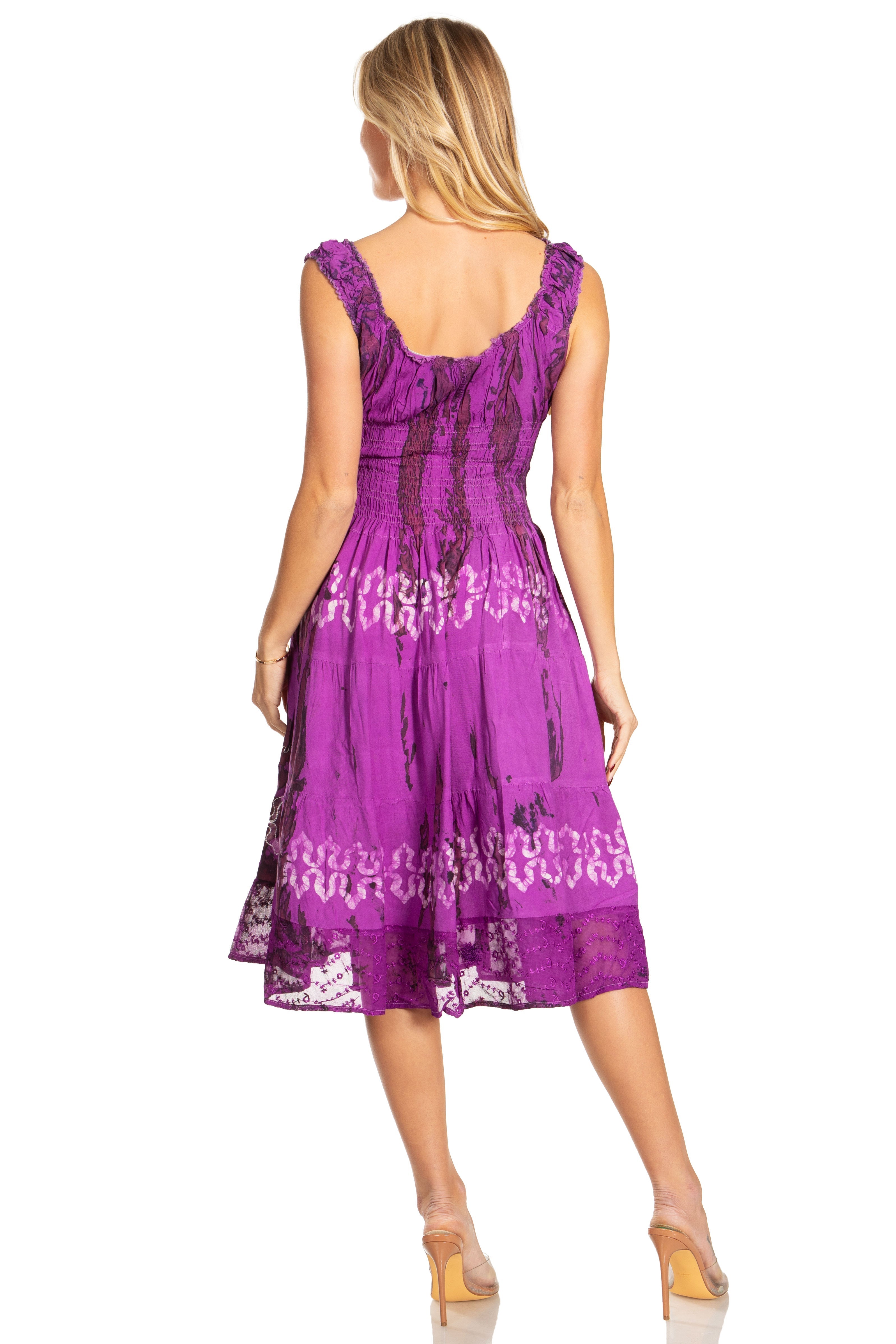 Woman wearing a purple lace dress on a white background