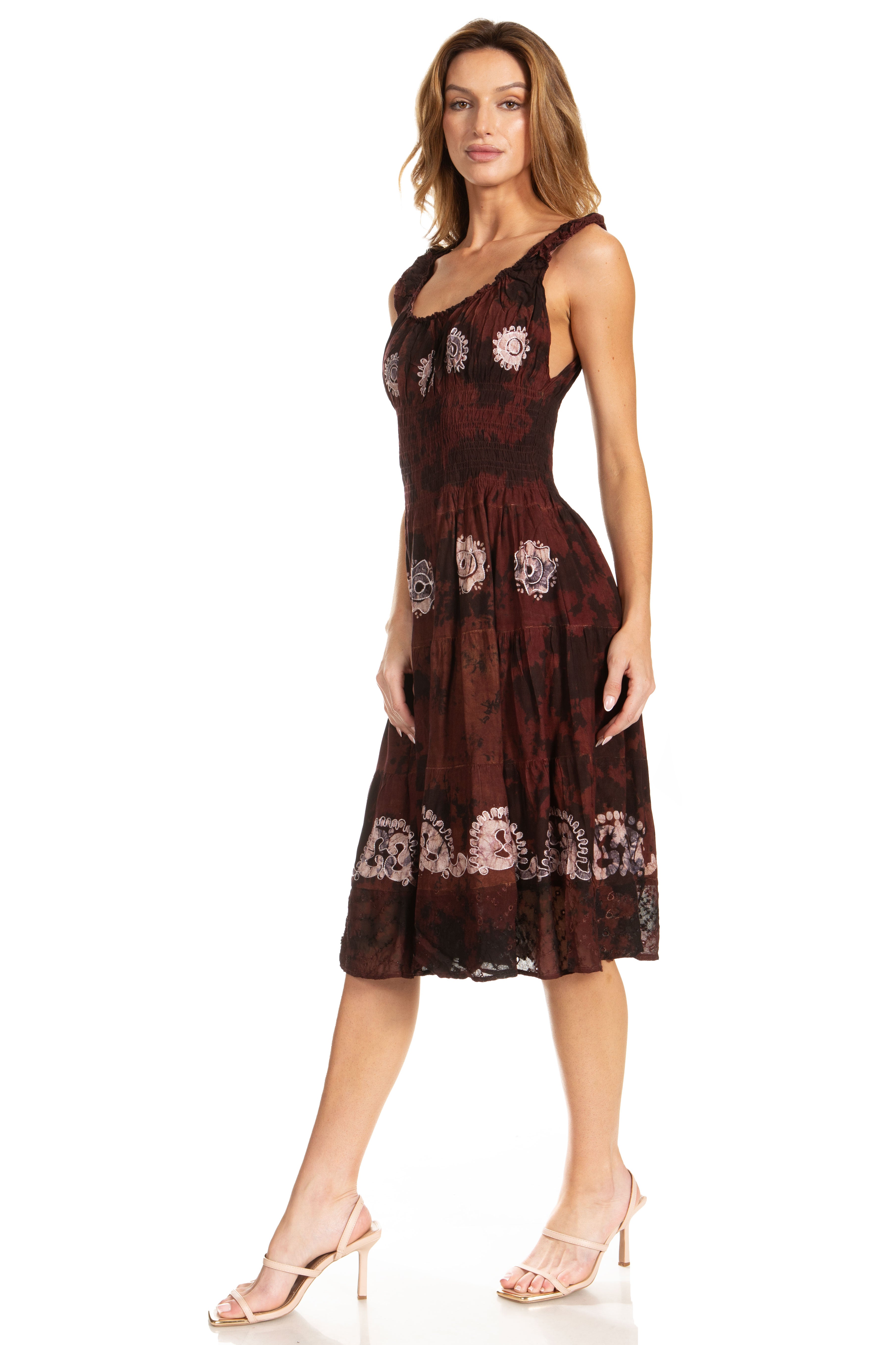 Woman wearing a dark red floral dress on a white background
