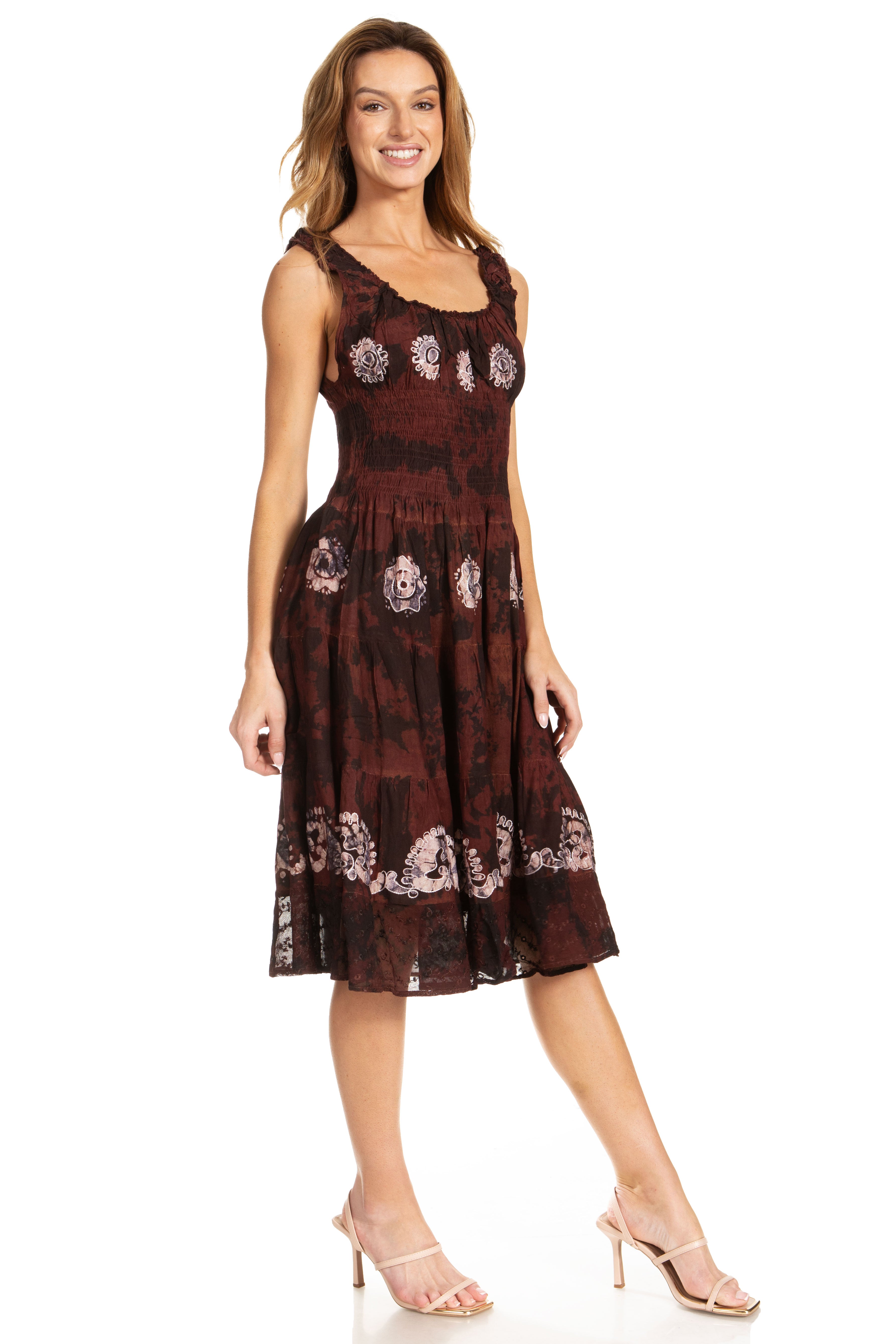 Woman wearing a brown floral dress on a white background