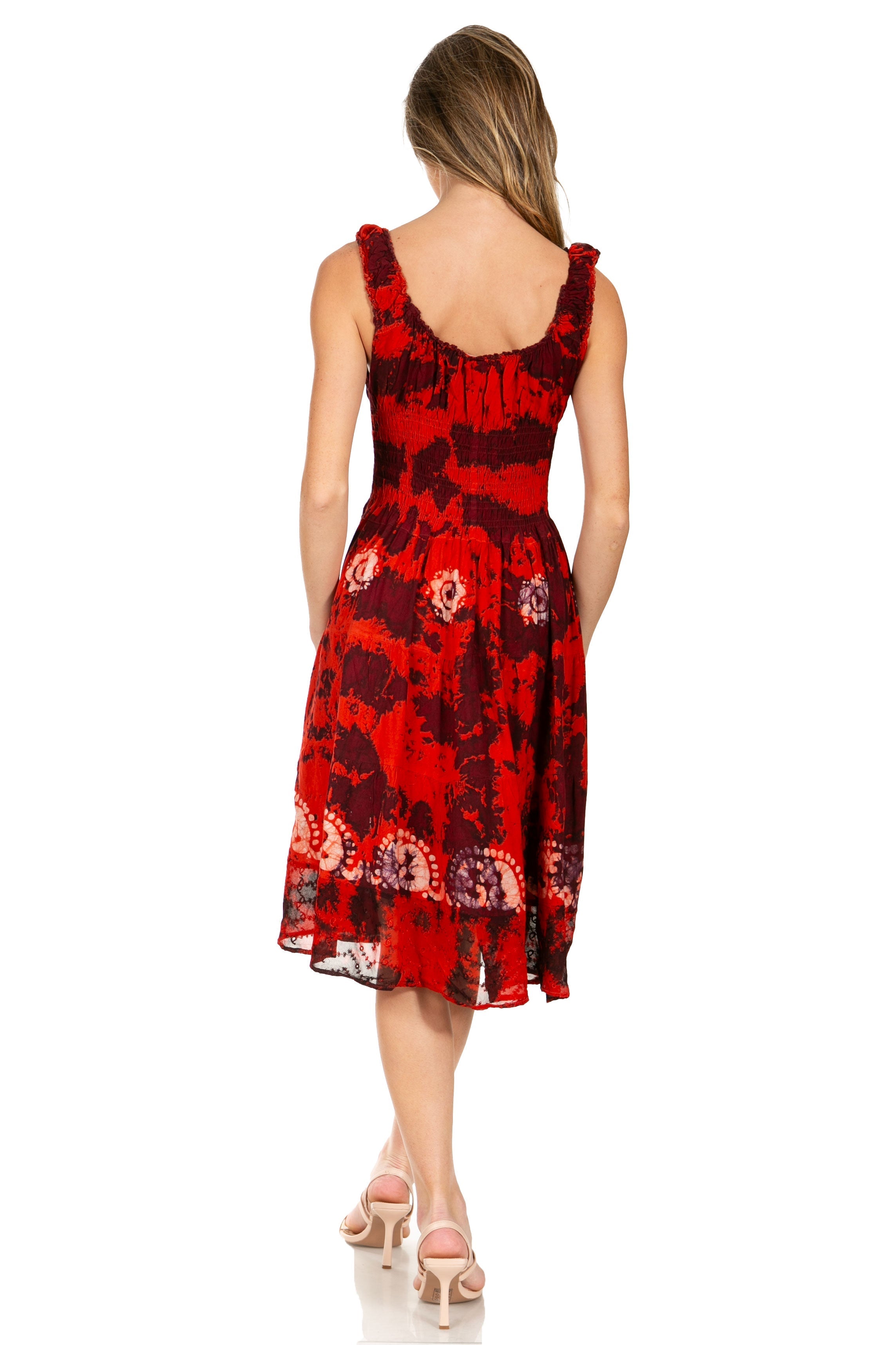 Woman wearing a red floral dress on a white background