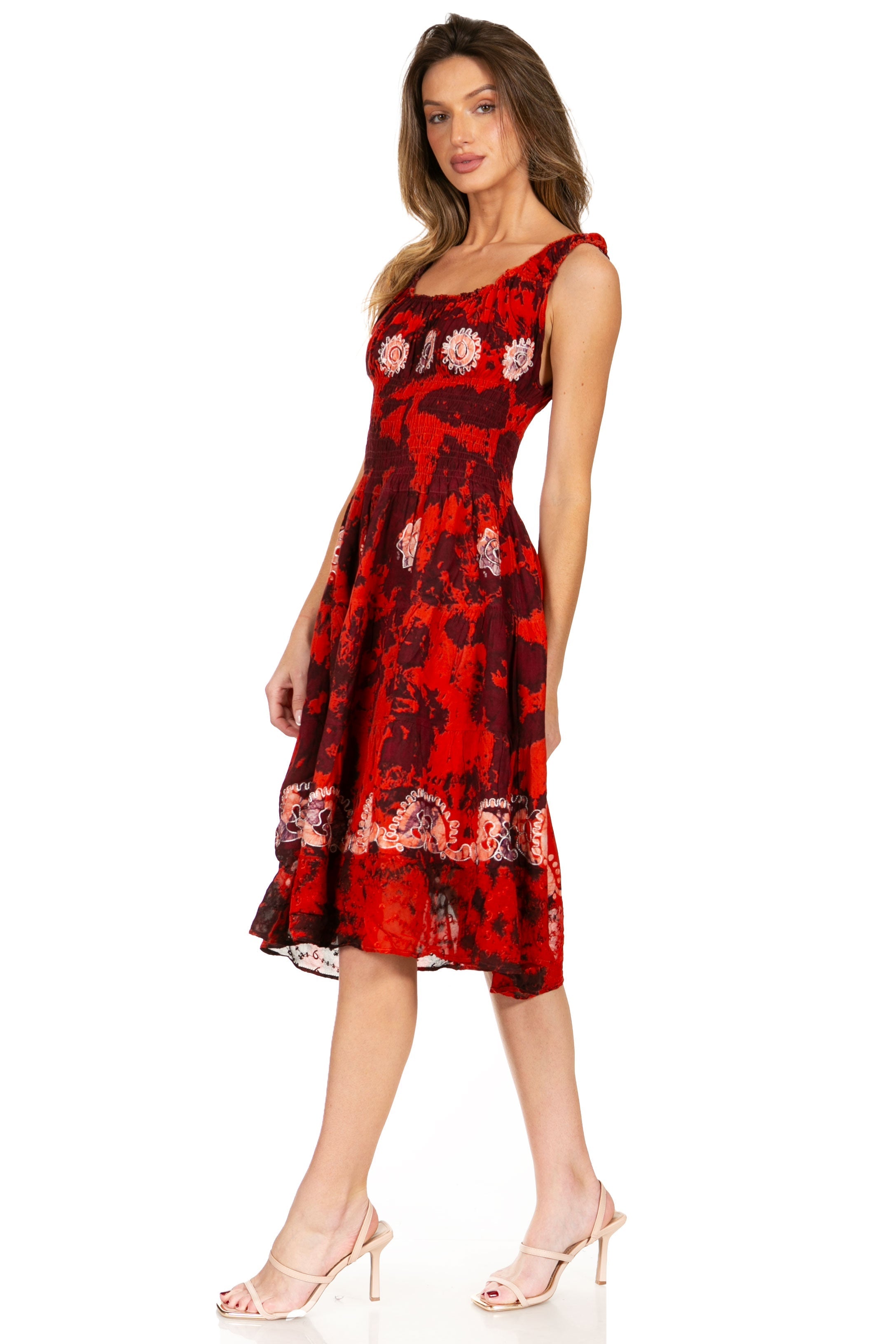Woman wearing a red floral dress on a white background