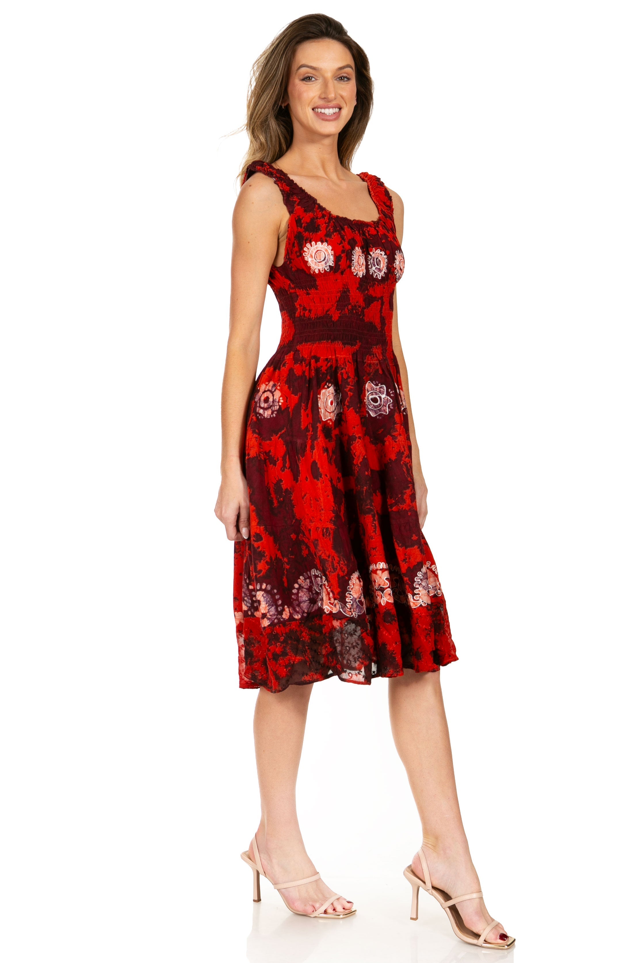 Woman wearing a red floral dress on a white background