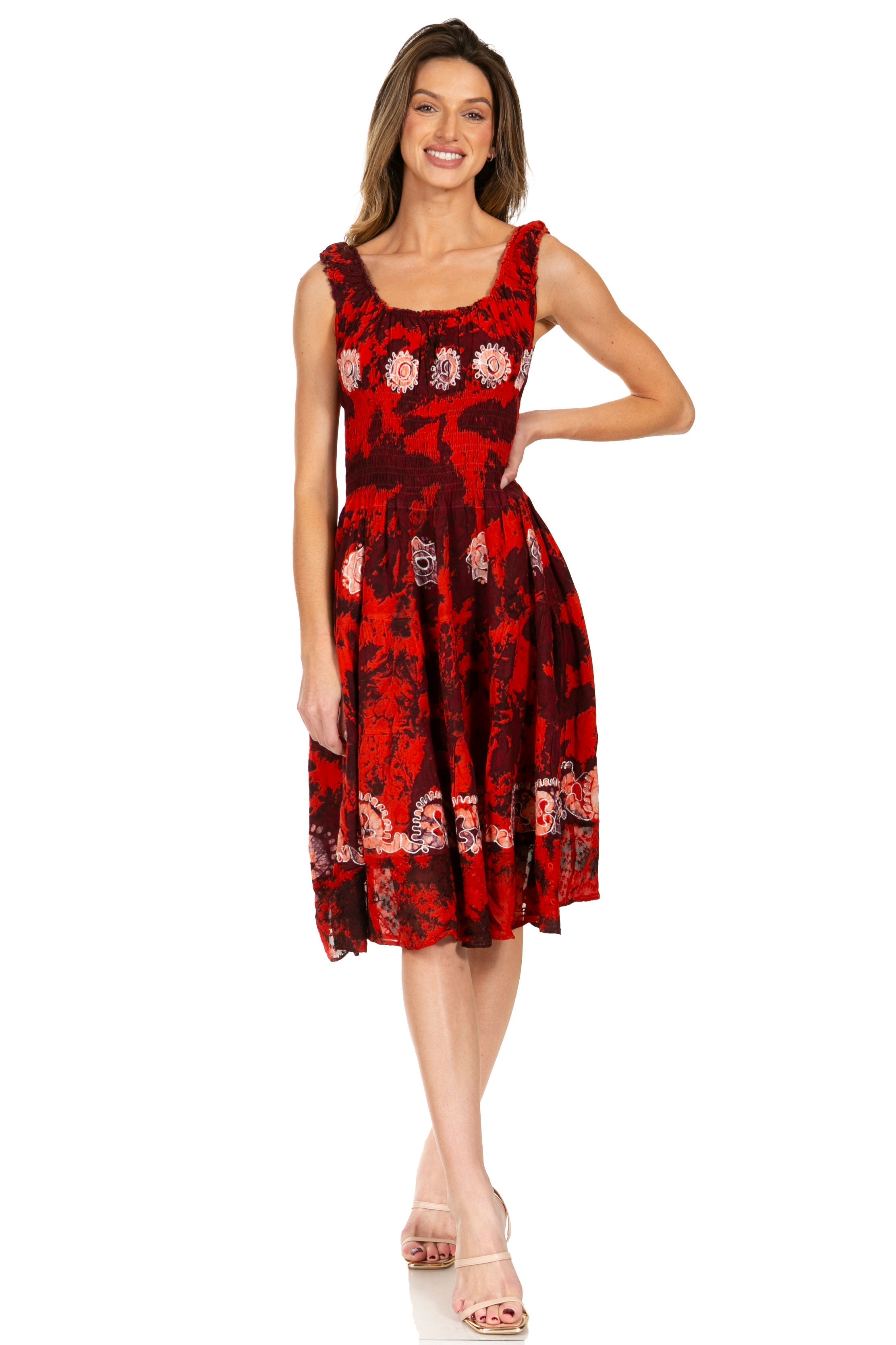 Woman wearing a red floral dress on a white background