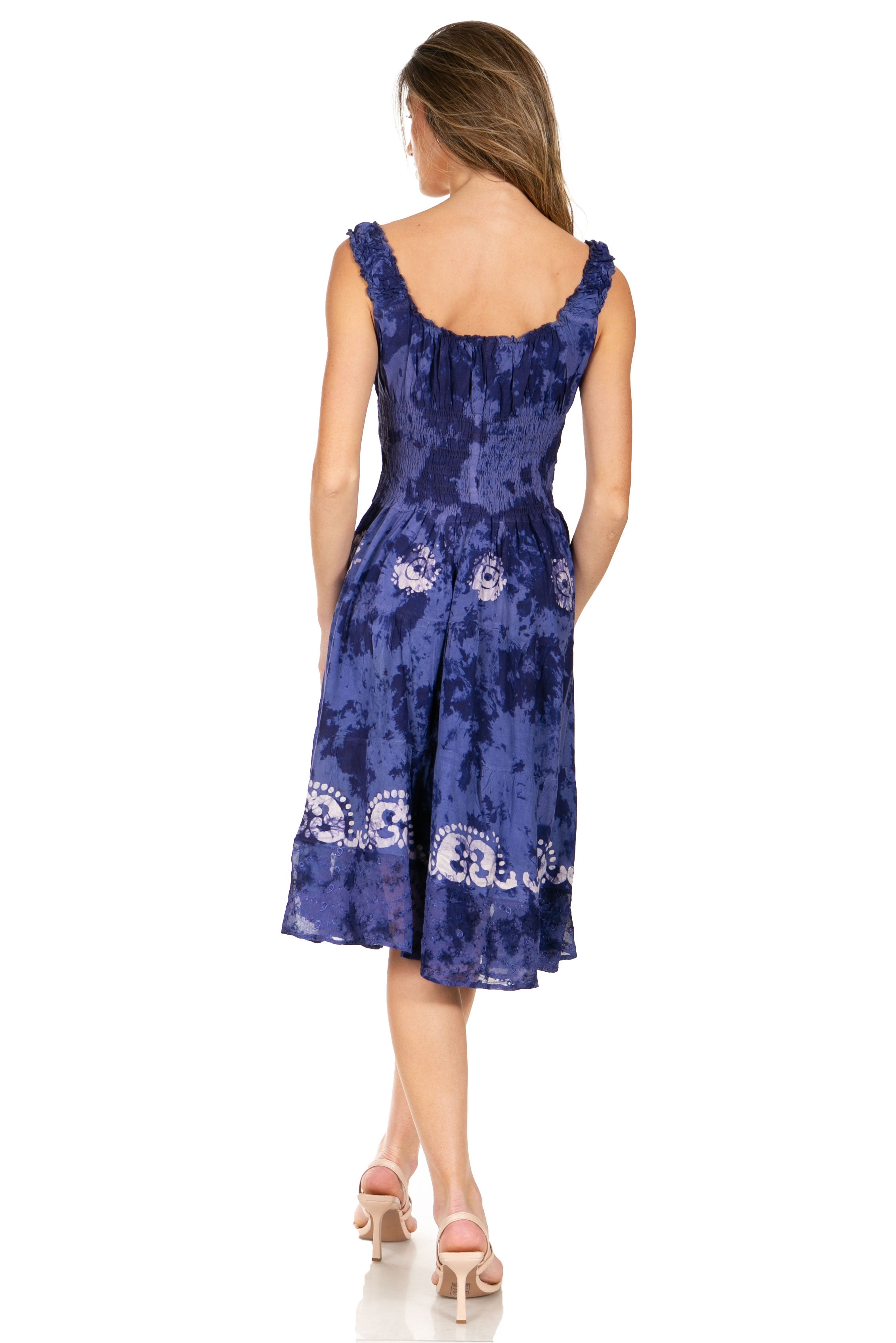 Woman wearing a blue floral dress on a white background